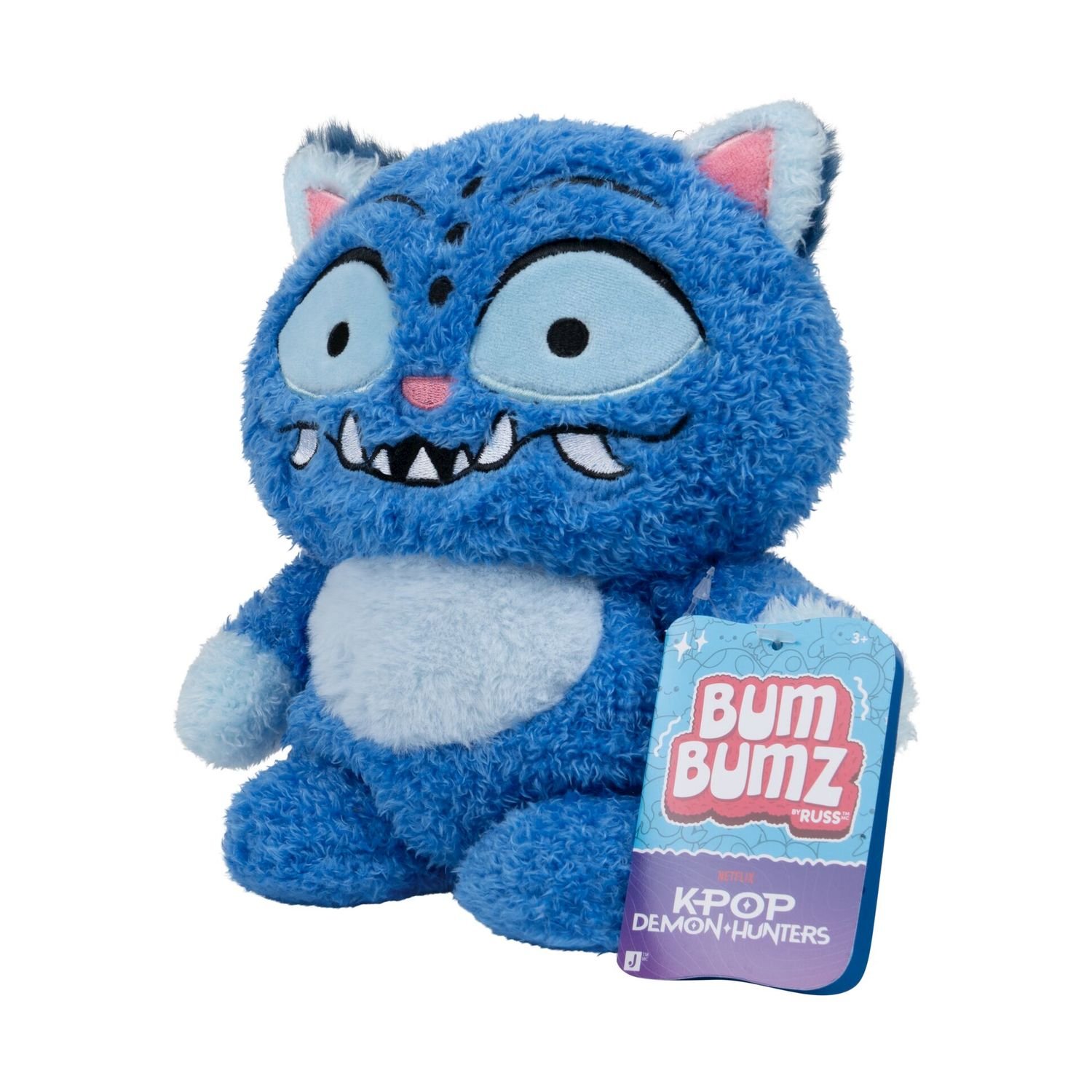 Un peluche mostro blu e soffice con occhi grandi e un'etichetta "Bum Bumz K-Pop Demon Hunters".