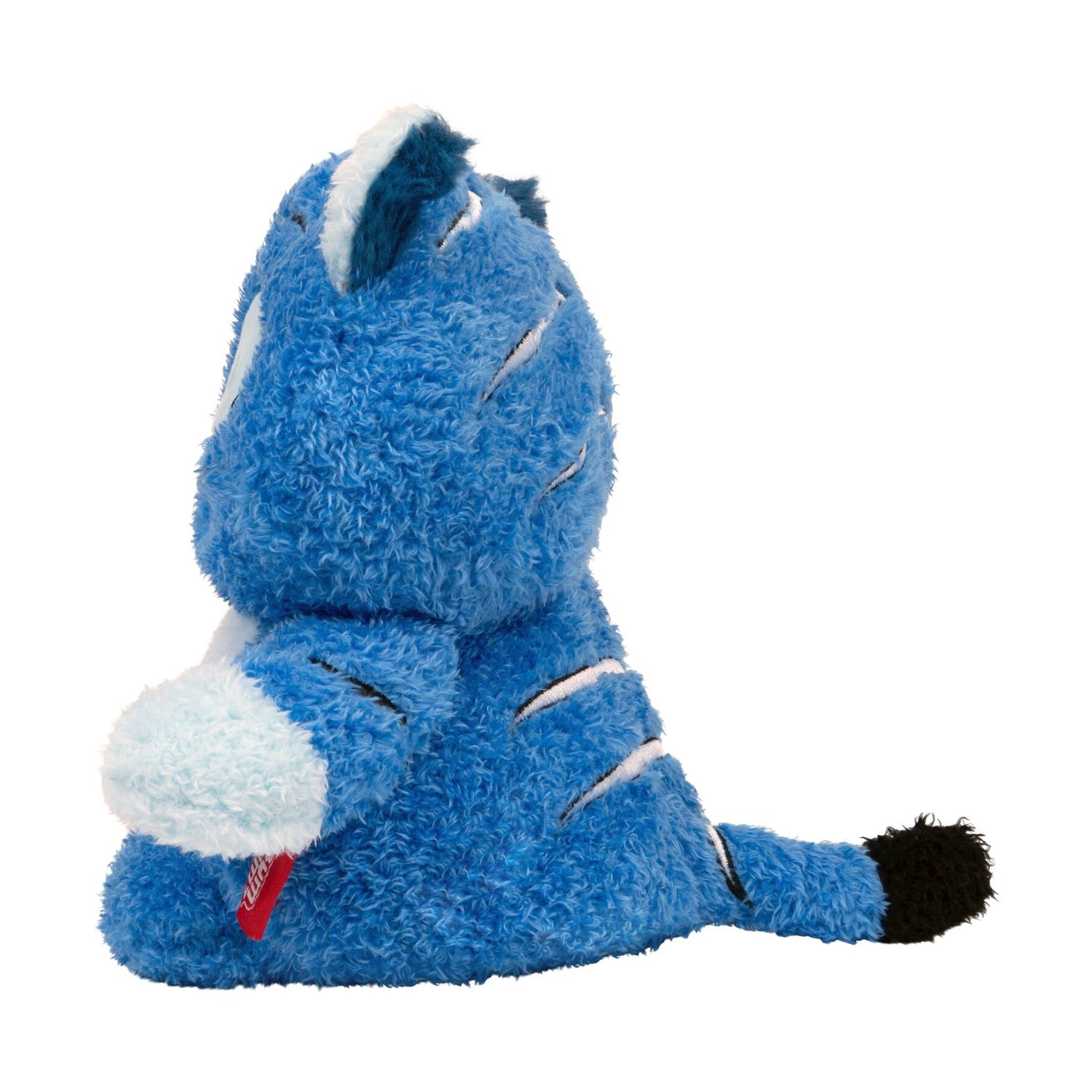 Una tigre di peluche blu siede di lato con un'etichetta rossa.