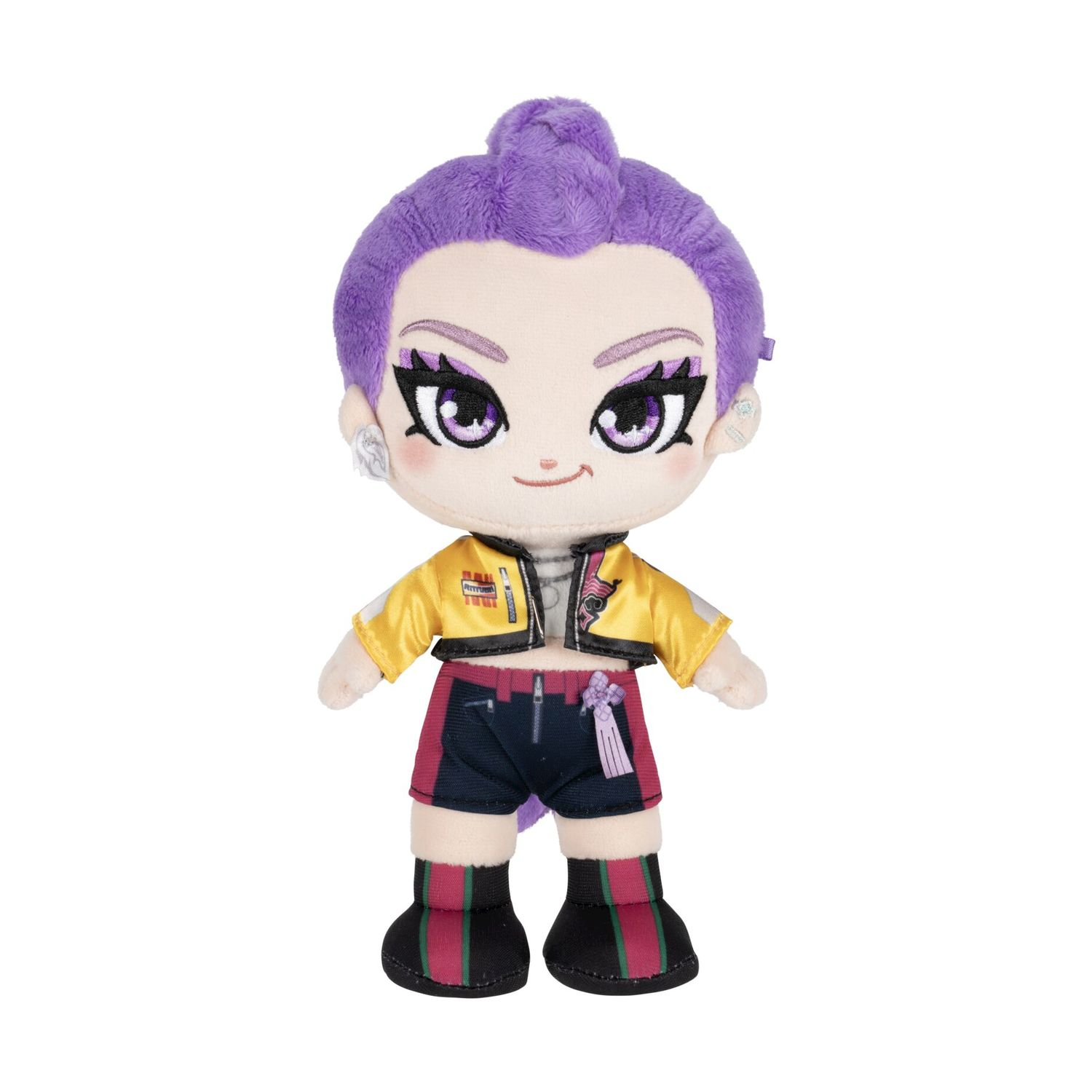 Peluche con capelli viola, giacca gialla e pantaloncini scuri a righe.