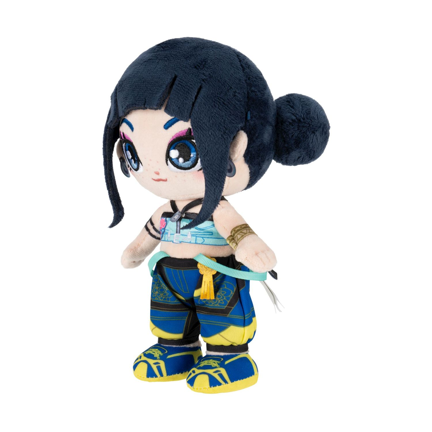 Peluche con capelli scuri, top blu, pantaloni blu e gialli e scarpe blu.