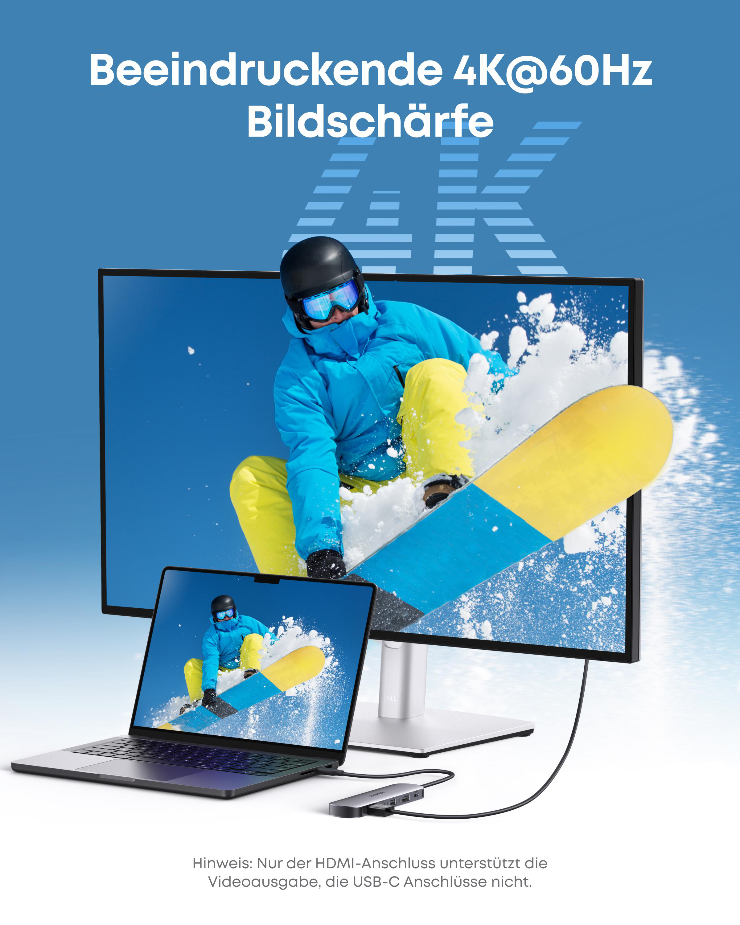 Ein Snowboarder springt in der Luft vor einem Monitor und Laptop. 4K@