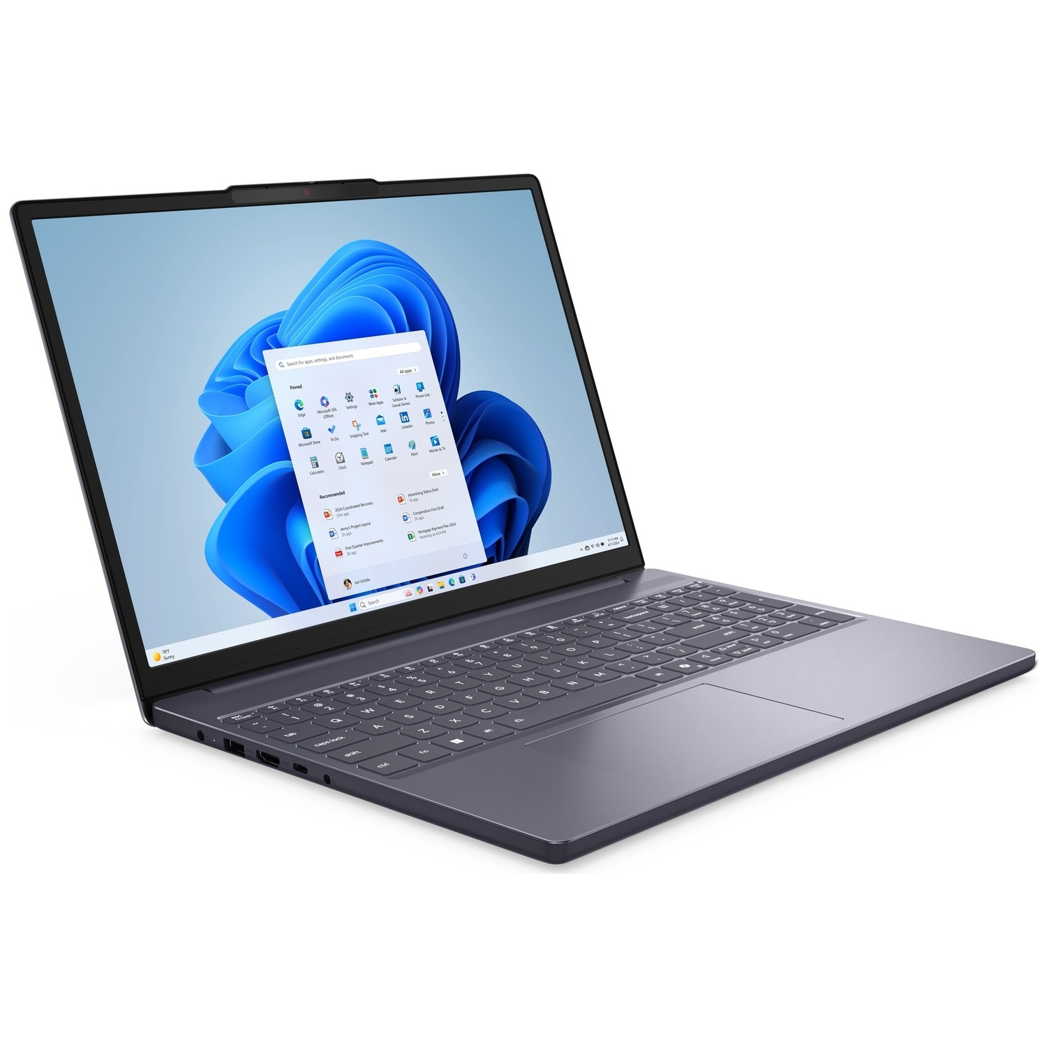 Een donkergrijze laptop is open, met het Windows 11 startmenu en een blauwe golfachtergrond.