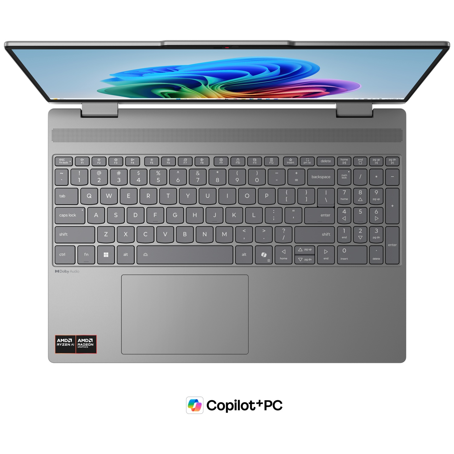 Un ordinateur portable gris ouvert avec écran et clavier allumés.