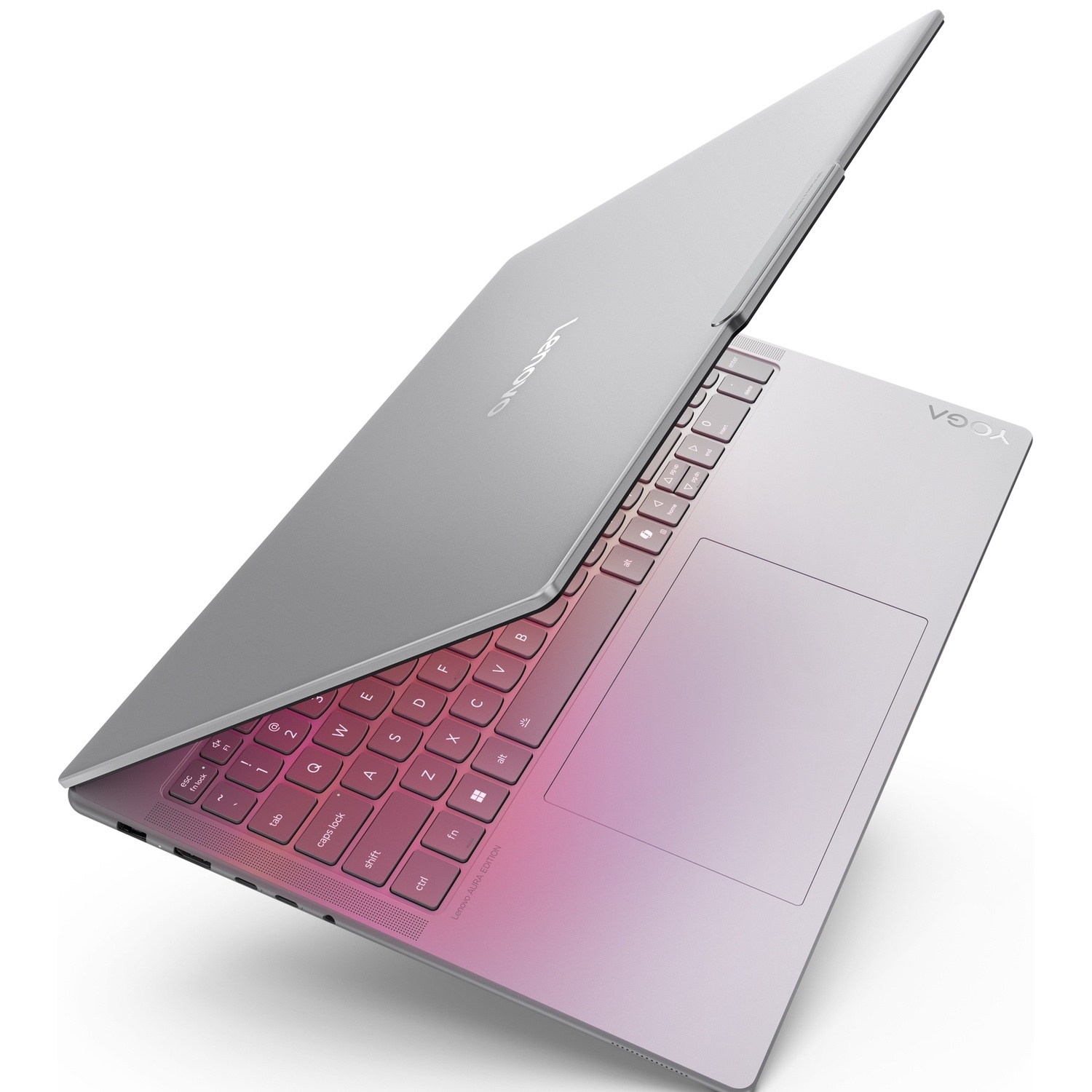 Ordinateur portable Lenovo Yoga argenté avec clavier rétroéclairé rose, ouvert sur fond blanc.