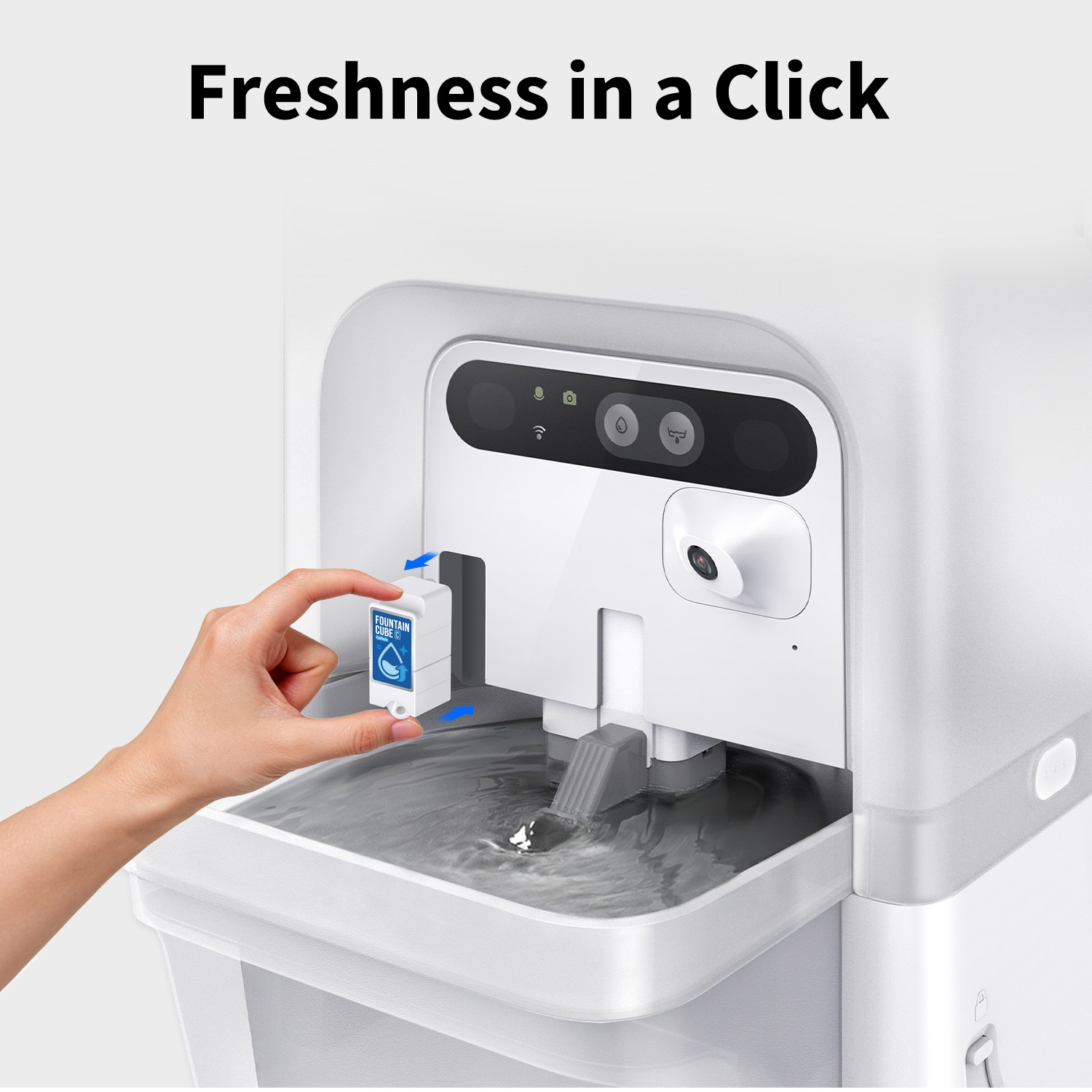 A hand inserts a small cube into a white water dispenser.