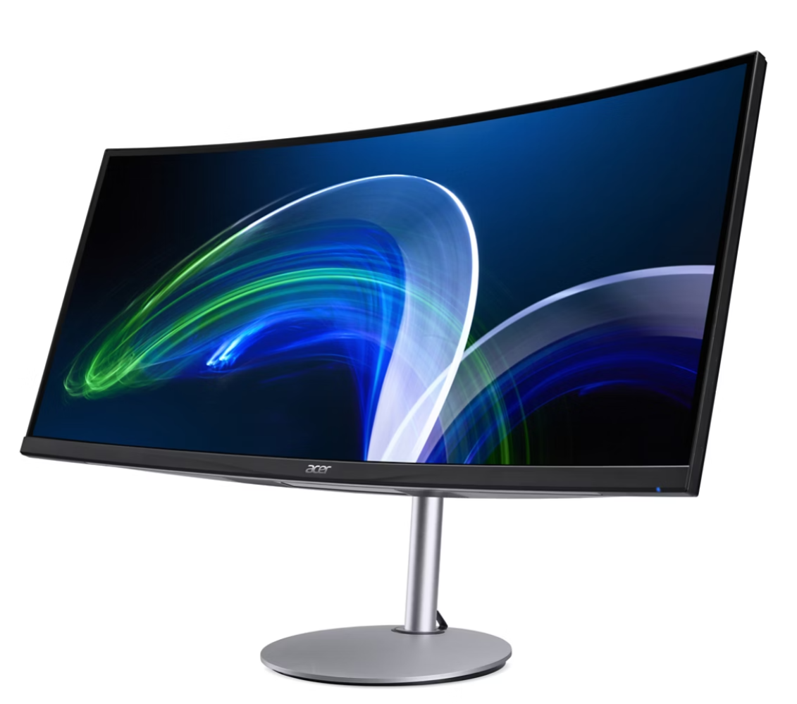 Egy ívelt Acer monitor absztrakt kék és zöld fénycsíkokat jelenít meg sötét háttéren.