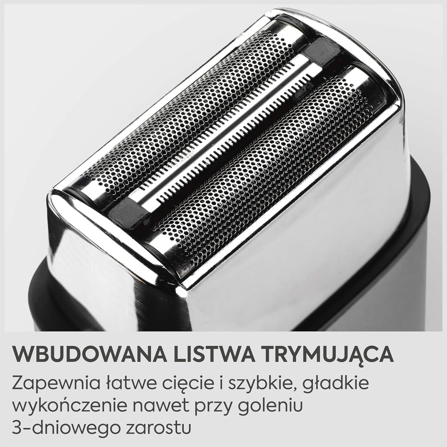Zbliżenie głowicy golarki z dwoma foliami i wbudowaną nasadką trymującą.