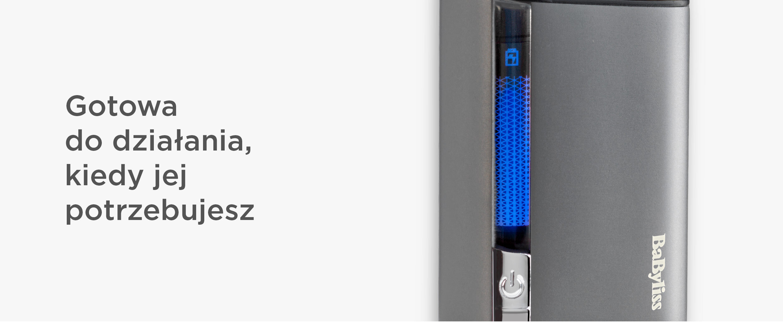 Szare urządzenie z niebieskim paskiem świetlnym i symbolem zasilania. Logo Babyliss.