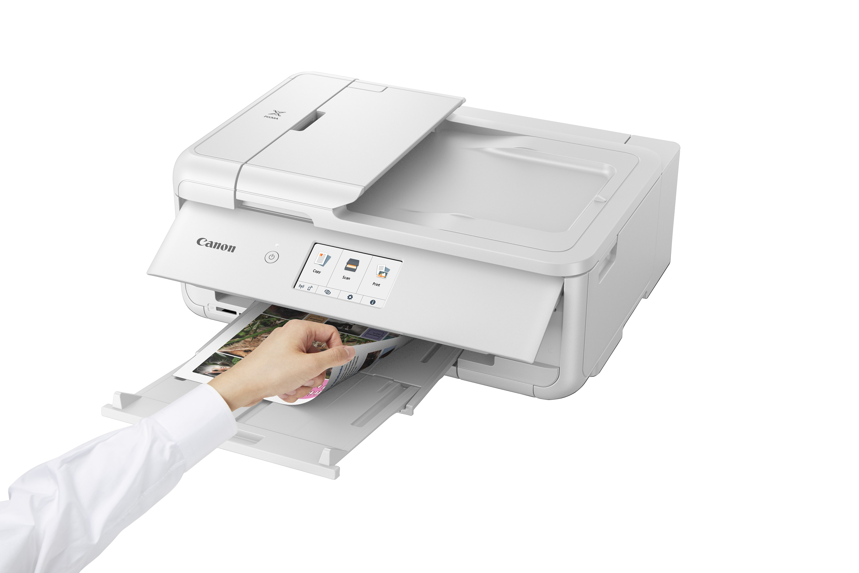 Vue supérieure d'une imprimante Canon blanche avec écran tactile et bac étendu avec du papier sortant.