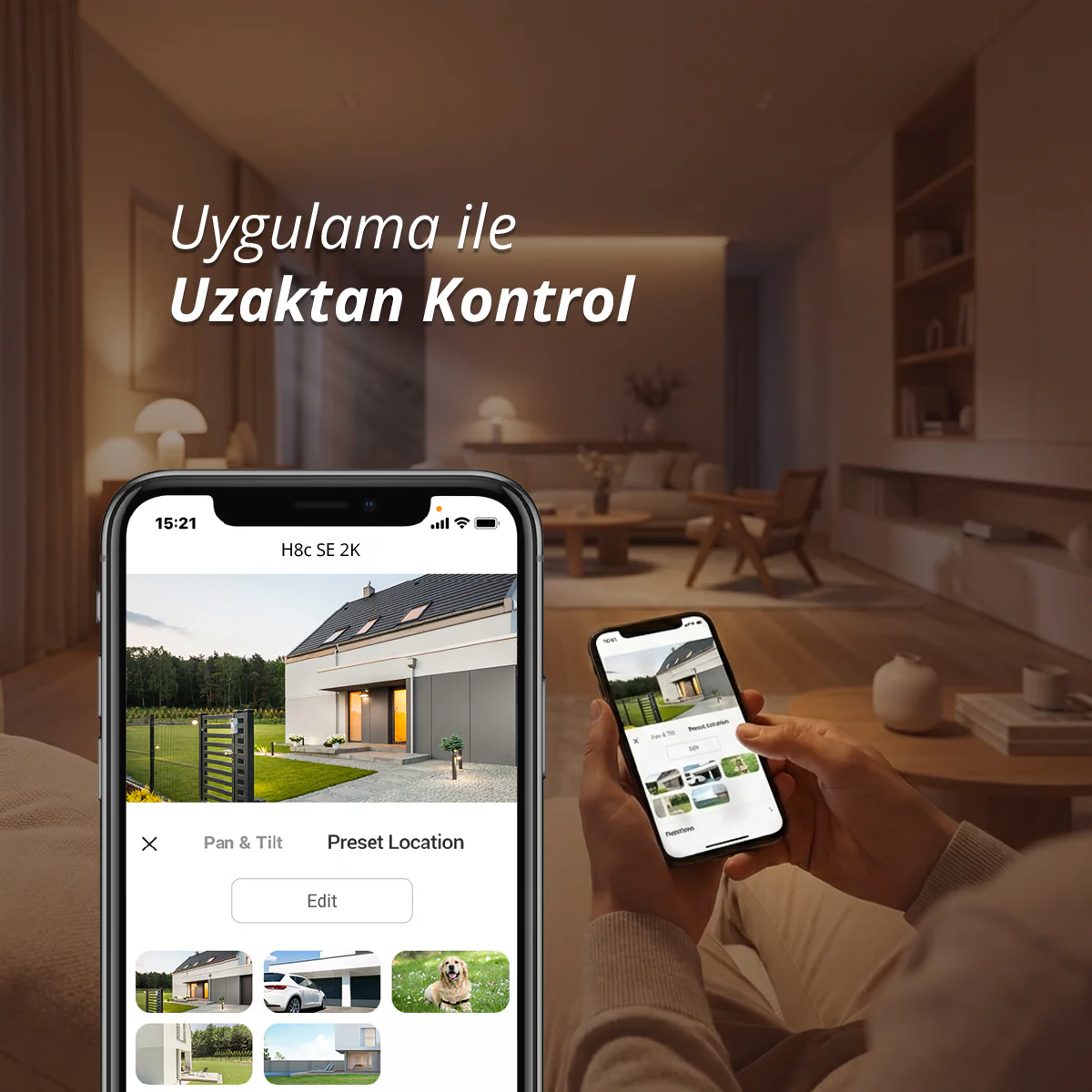 Bir kişi, ev görüntüsü içeren bir ev güvenlik uygulaması gösteren akıllı telefon tutuyor.