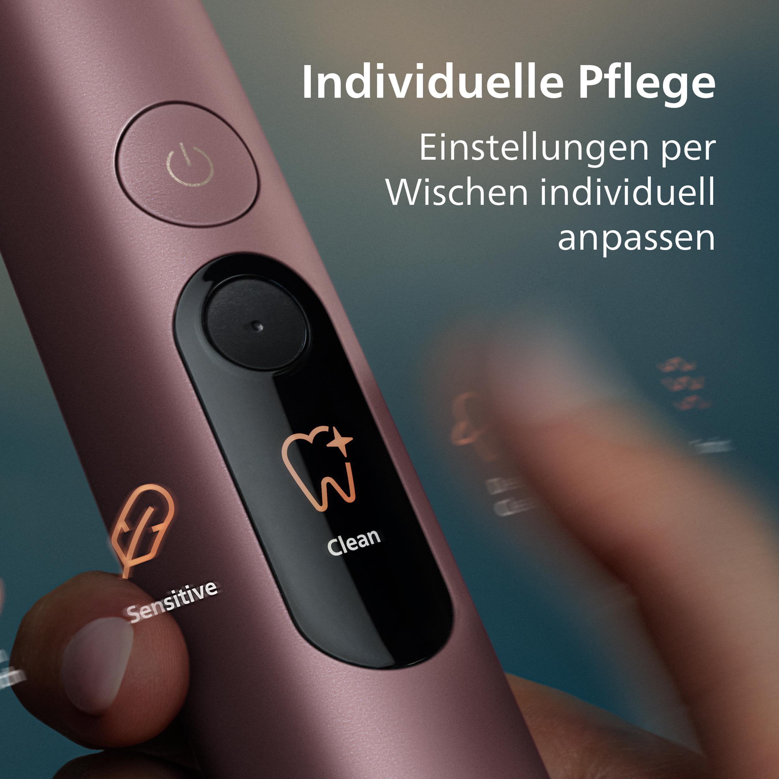 Rosafarbene Zahnbürste mit Power-Knopf und Symbolen für sensitive und Reinigungsmodi.