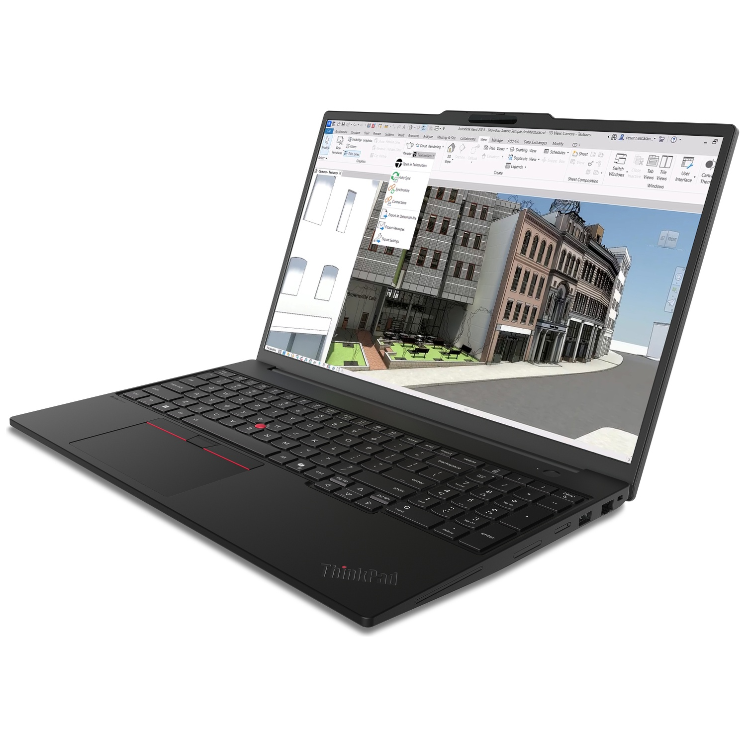 A black laptop displays an architectural model with buildings and outdoor seating.
