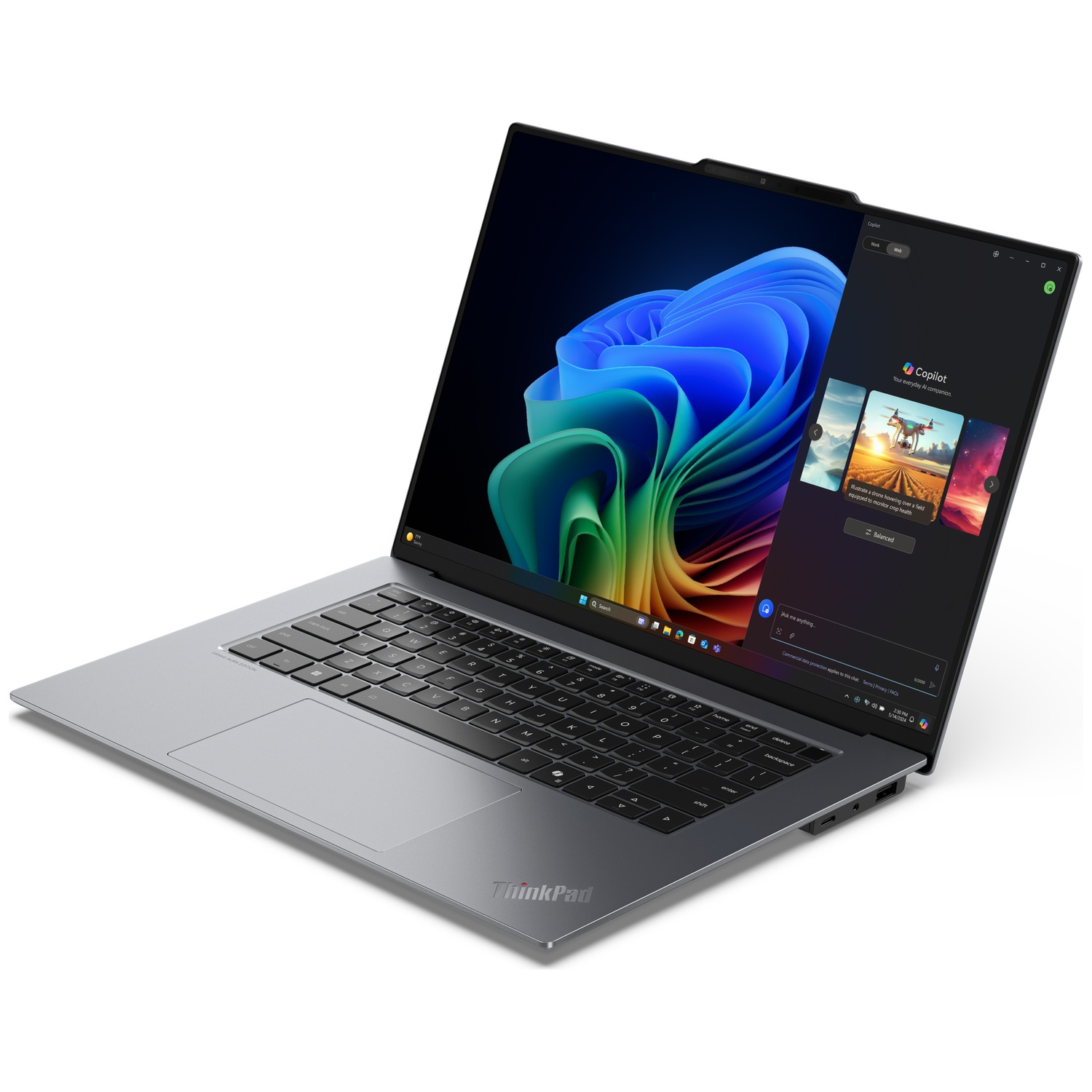 A gray ThinkPad laptop displaying the Copilot AI assistant on its screen.