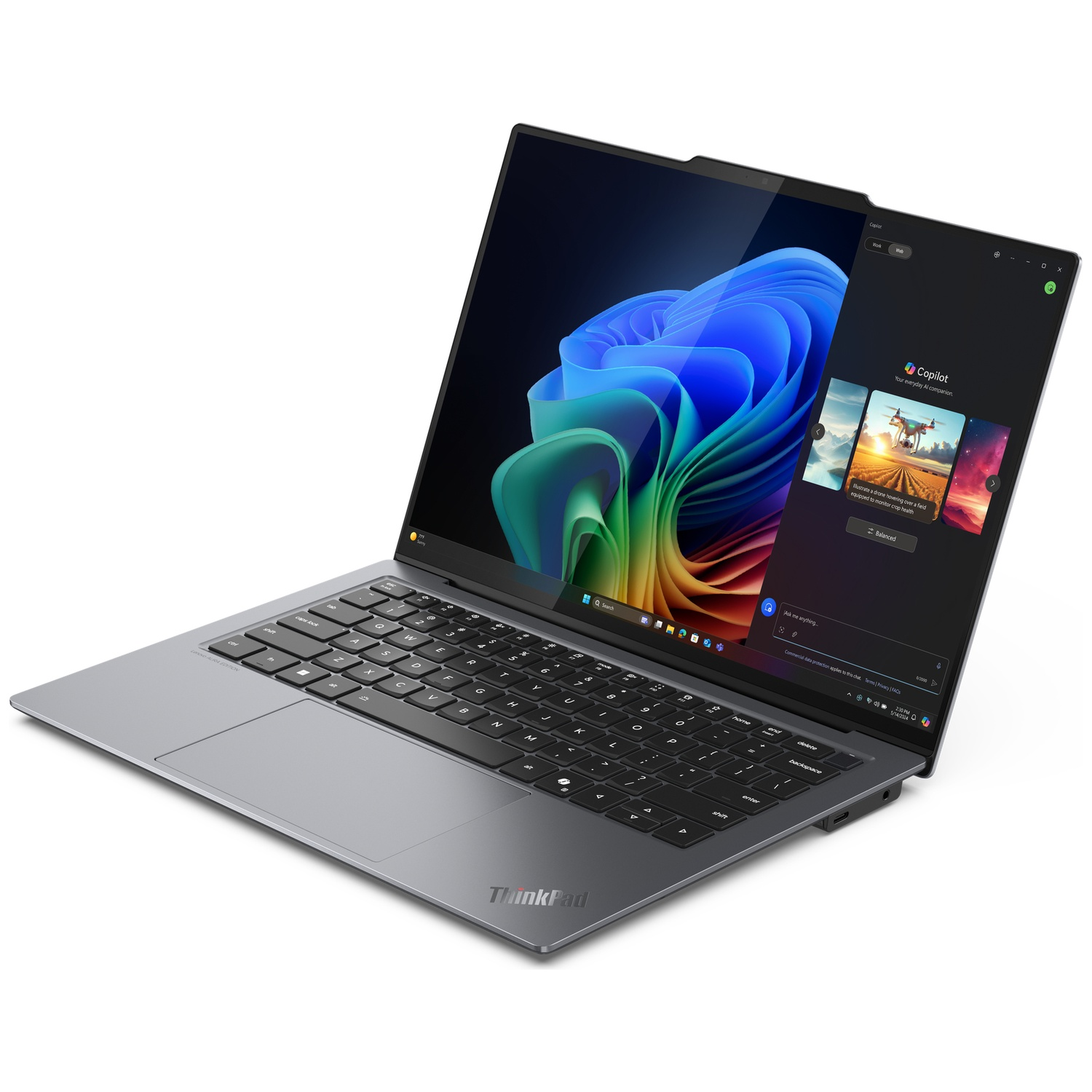 An open laptop displaying a colorful wallpaper and a Copilot window on the side.
