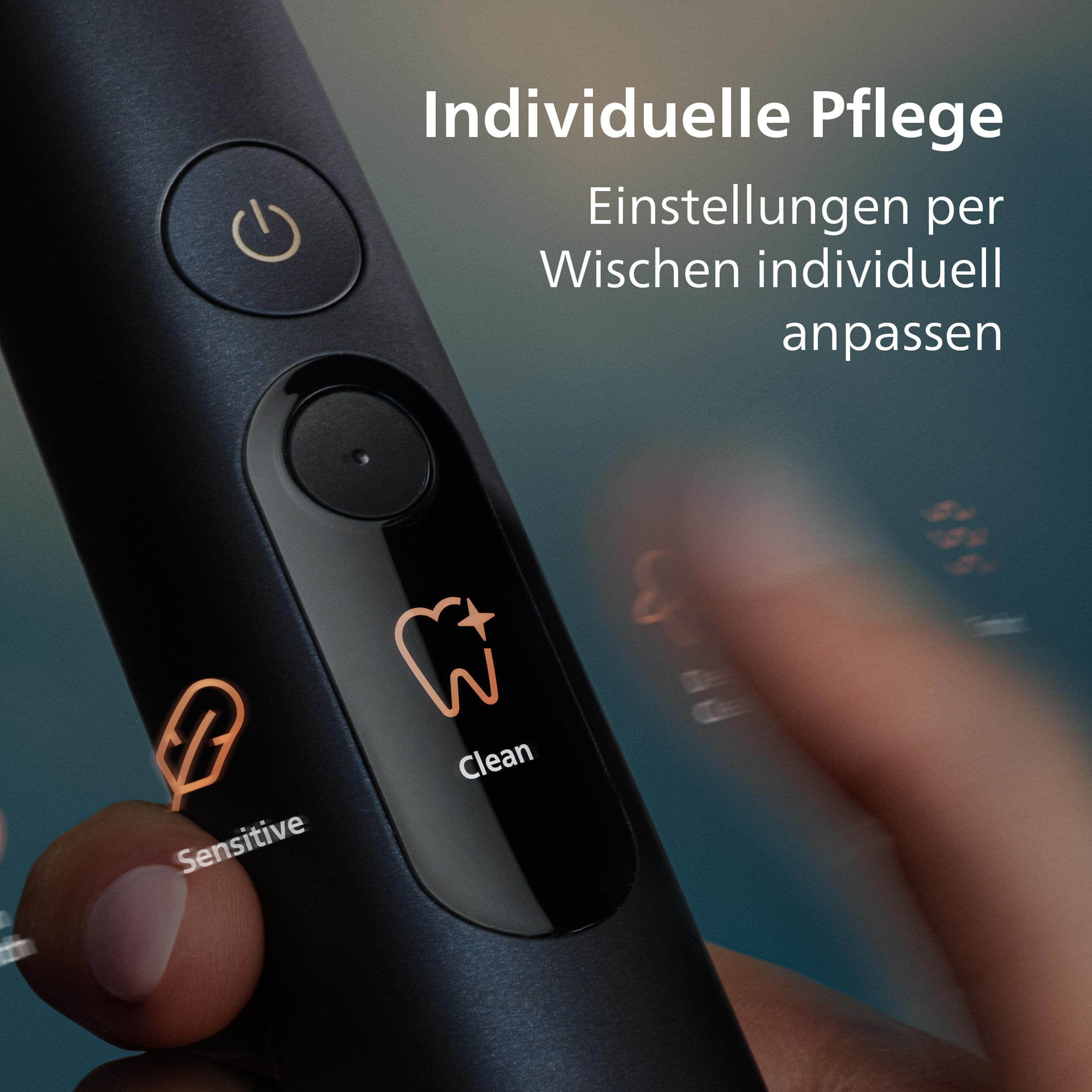 Nahaufnahme einer schwarzen elektrischen Zahnbürste mit beleuchteten Symbolen.