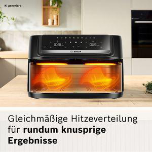 Ein schwarzer Bosch Heißluftfritteuse mit zwei Heizspiralen, die leuchten.