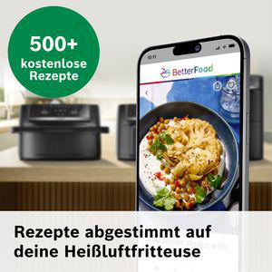 Ein Smartphone zeigt ein Blumenkohlgericht, neben einer Heißluftfritteuse.