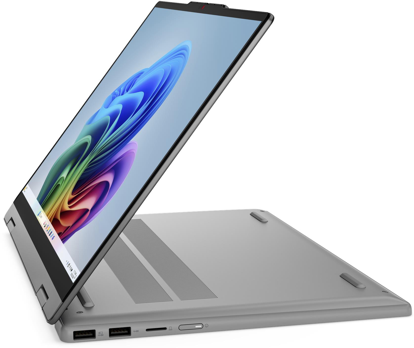 Egy ezüst laptop nyitott képernyővel, színes háttérképet jelenít meg.