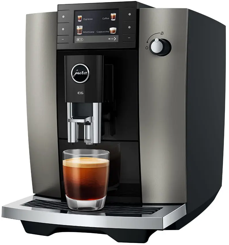 Una macchina da caffè moderna con un bicchiere di espresso, pronta per servire.