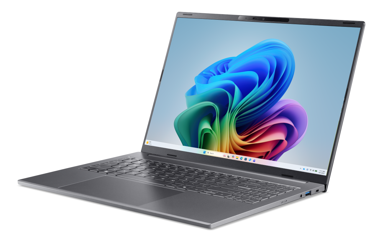 Szary laptop z kolorową tapetą systemu Windows na ekranie.