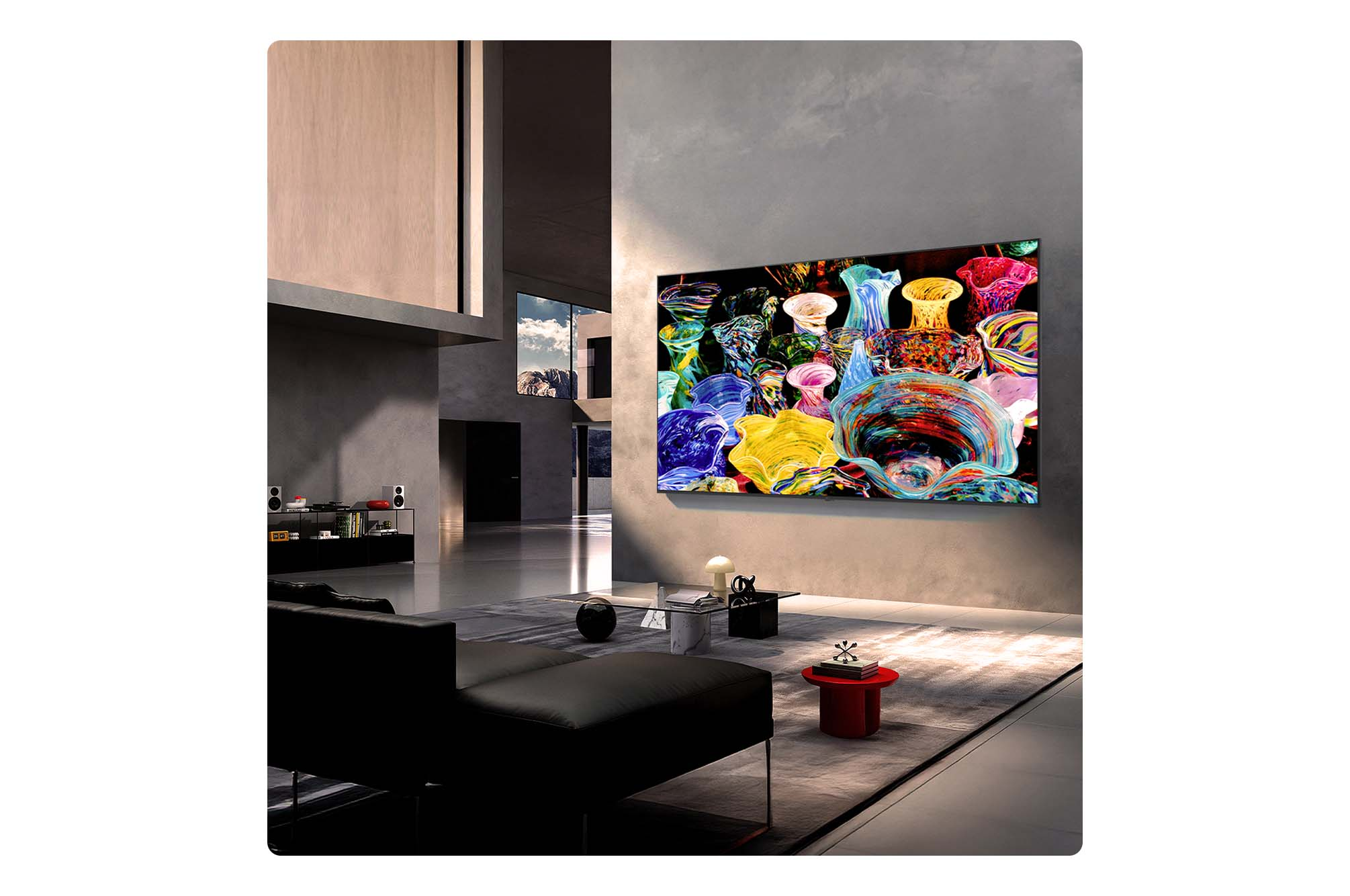 Un salon moderne avec une grande télévision affichant des objets en verre colorés.