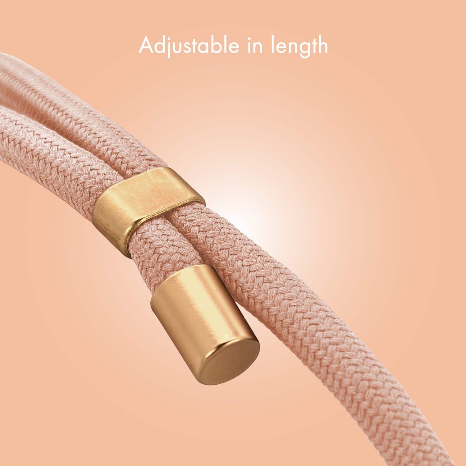 Two pink cords with gold hardware on an apricot background.
