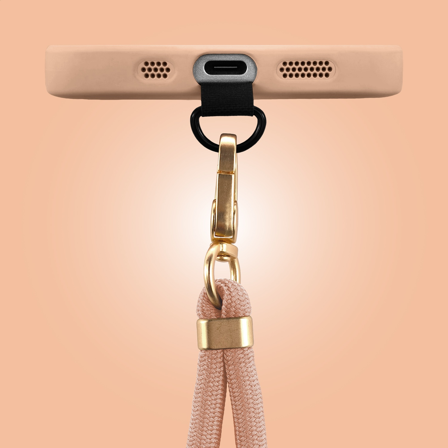 A beige phone case with a gold clasp and a cord.