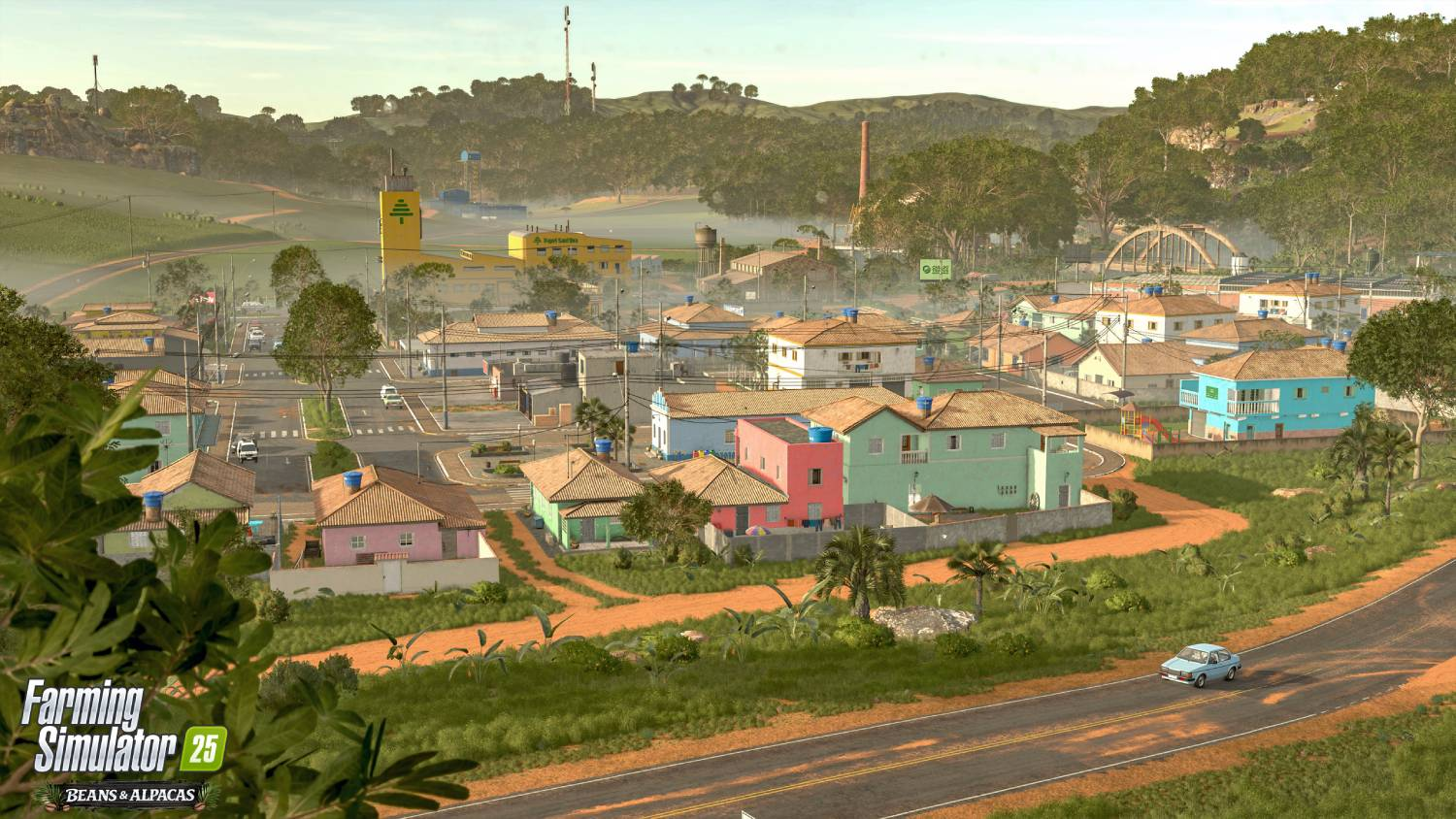Un pueblo pequeño con casas coloridas, colinas y un coche azul en la carretera.