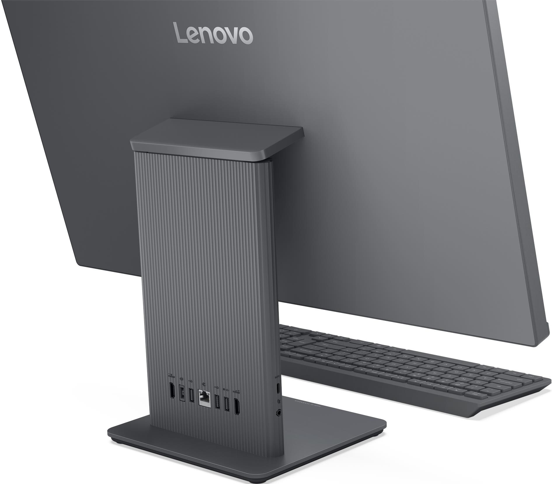 Un ordinateur tout-en-un Lenovo gris avec clavier et ports sur le côté.