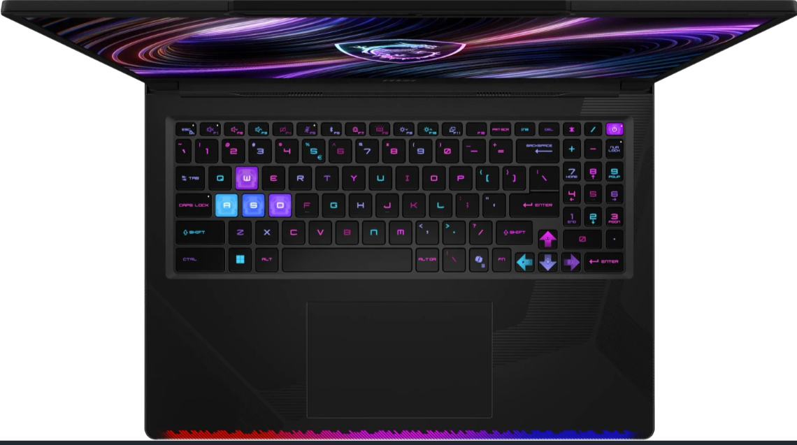 Ein geöffneter Laptop mit beleuchteter Tastatur und dynamischem Hintergrundbild.
