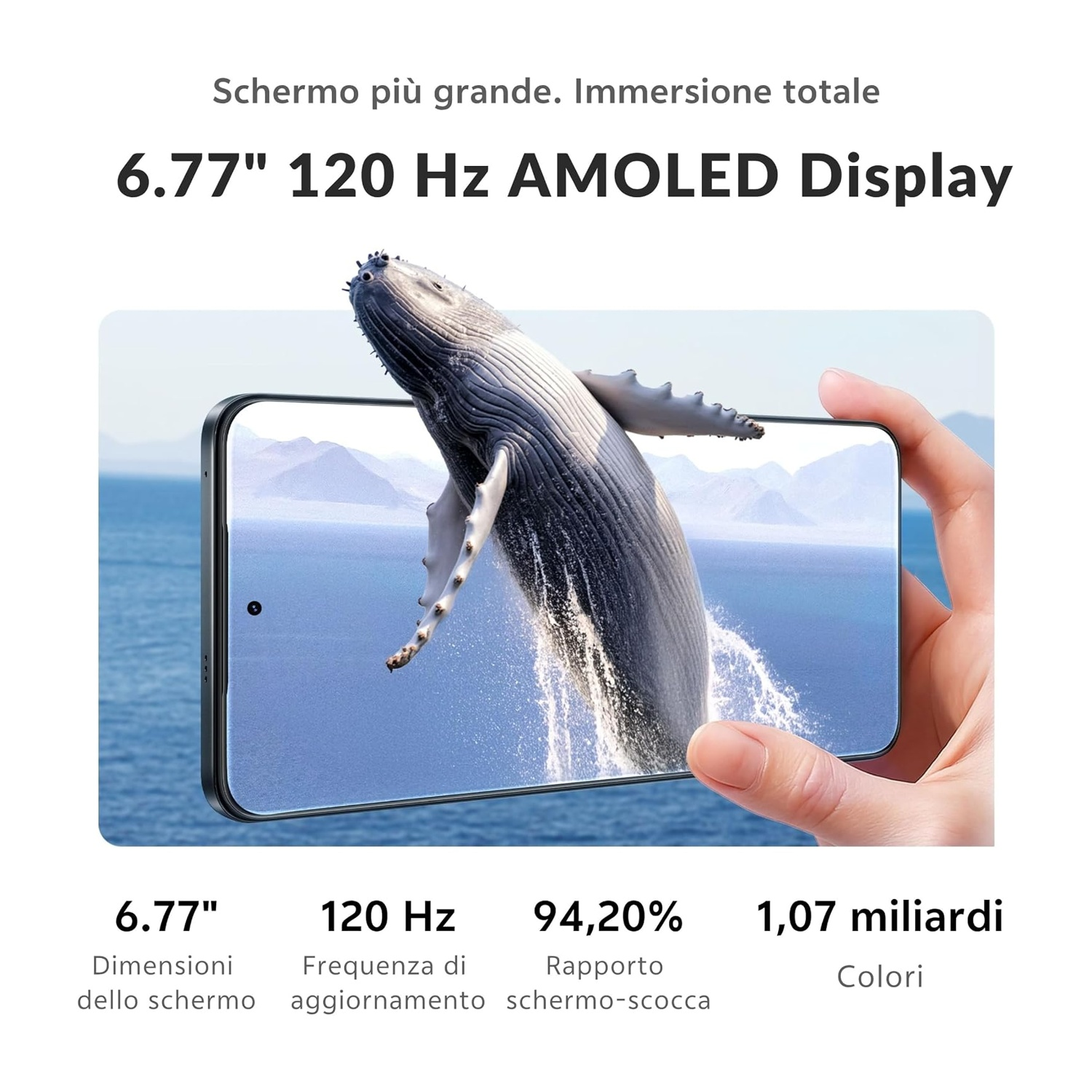 Una mano tiene un telefono che mostra una balena che salta dall'acqua sul suo schermo AMOLED da 6,77 pollici e 120 Hz.