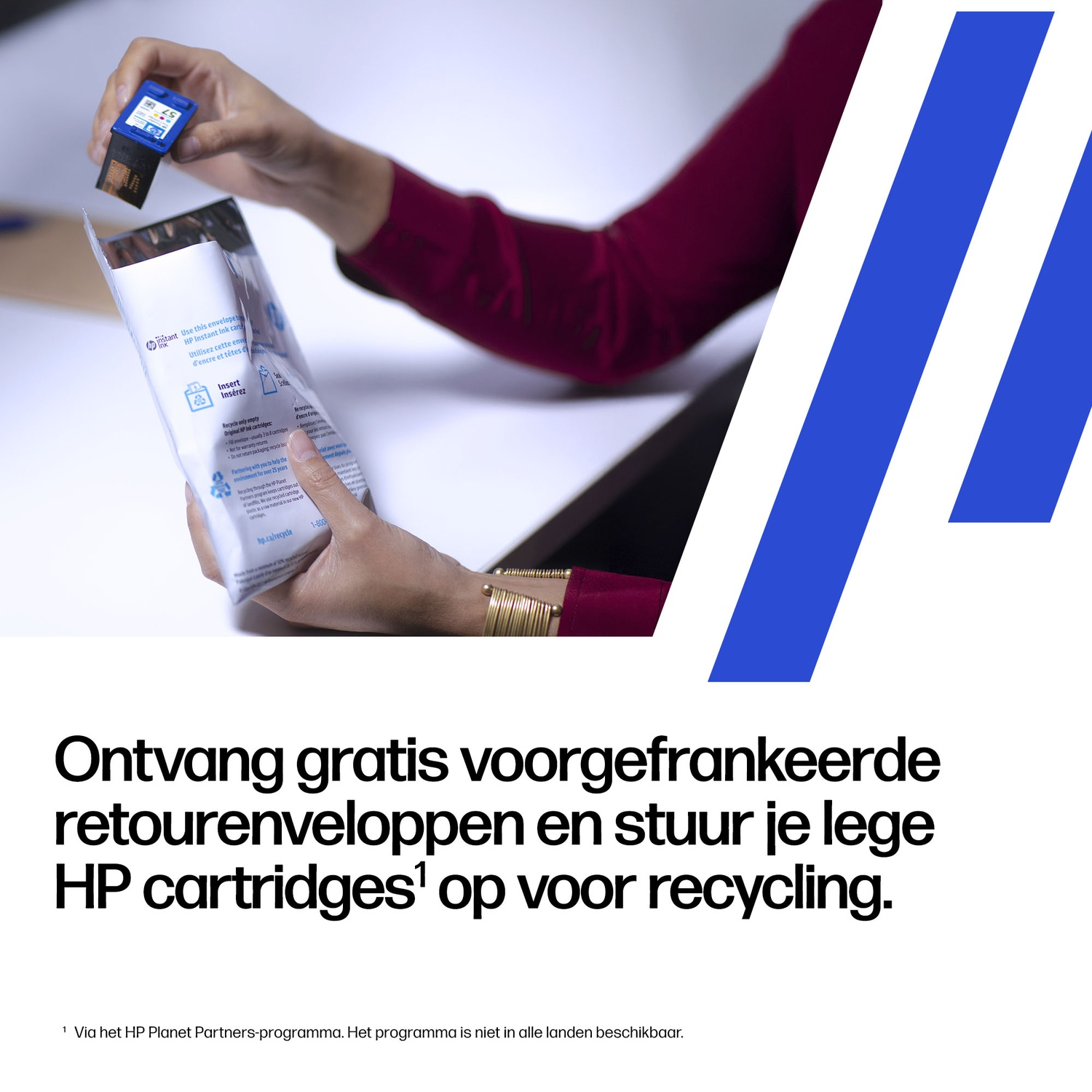 Person holds a blue HP ink cartridge over a return envelope.