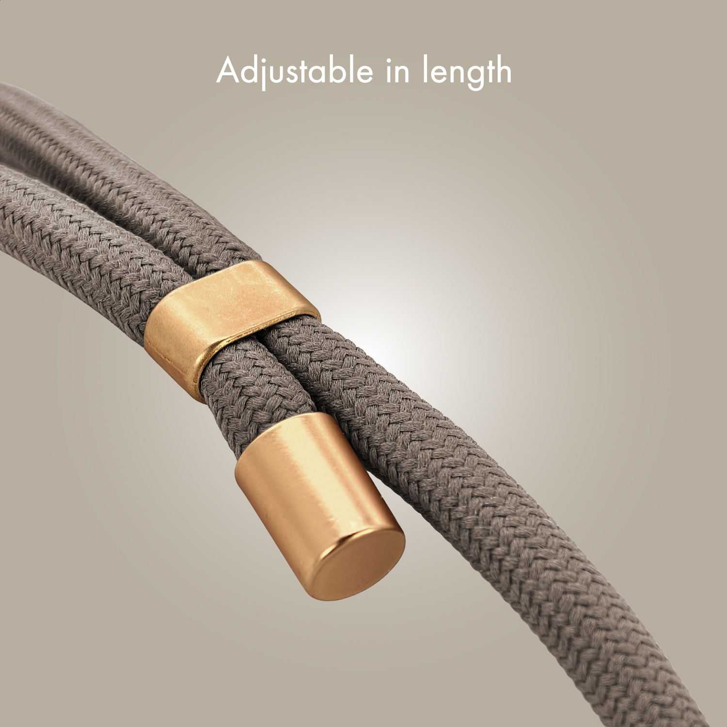 Grey rope with gold caps, adjustable in length.