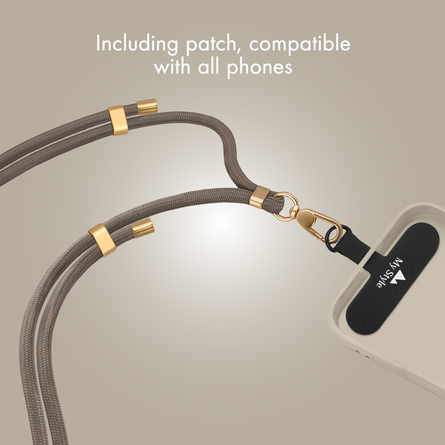Gray lanyard with gold accents attached to a light beige phone.