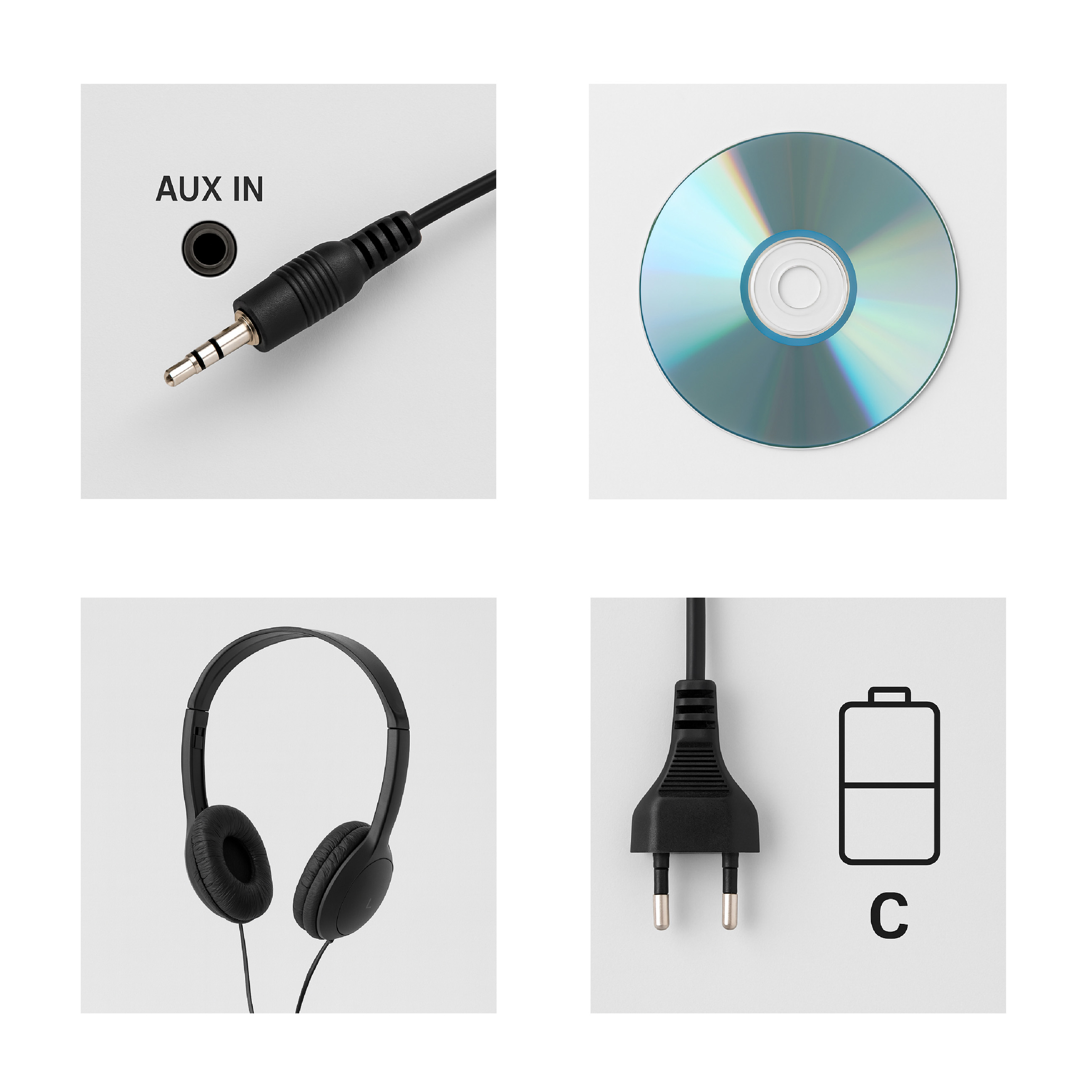 Nahaufnahme eines AUX-Kabels, einer CD, Kopfhörer und eines Netzsteckers.
