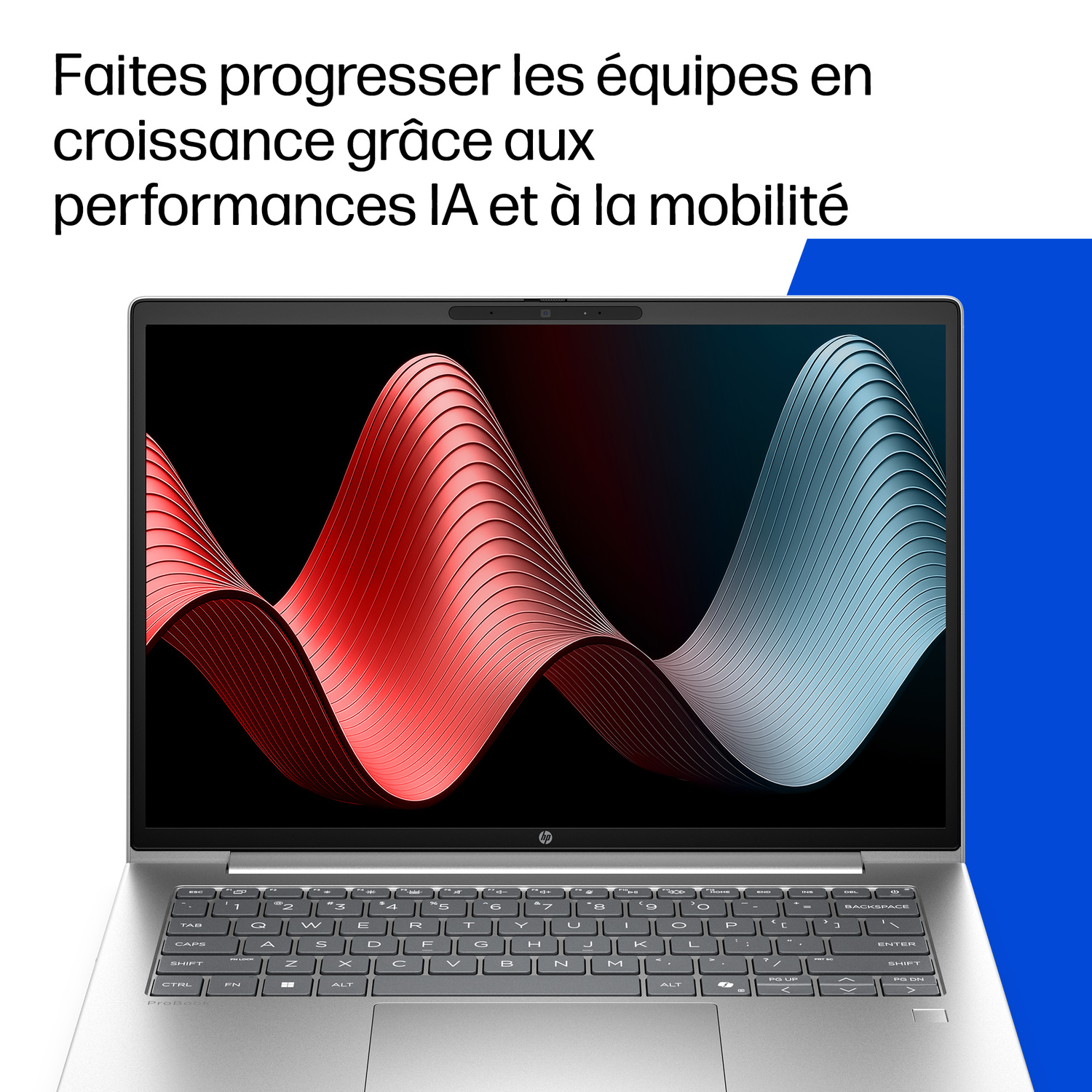 Un ordinateur portable argenté affiche un motif dynamique d'ondes rouges et bleues.