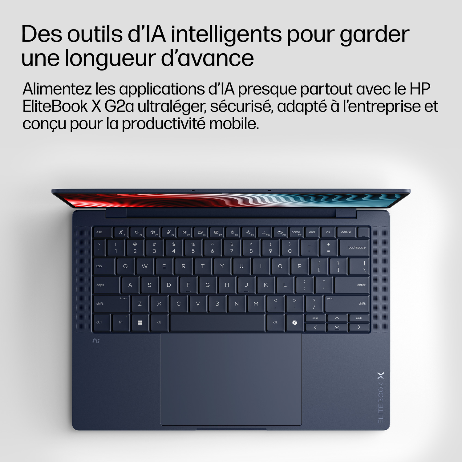 Un ordinateur portable HP EliteBook X G2a ouvert, bleu foncé, montrant clavier et touchpad.