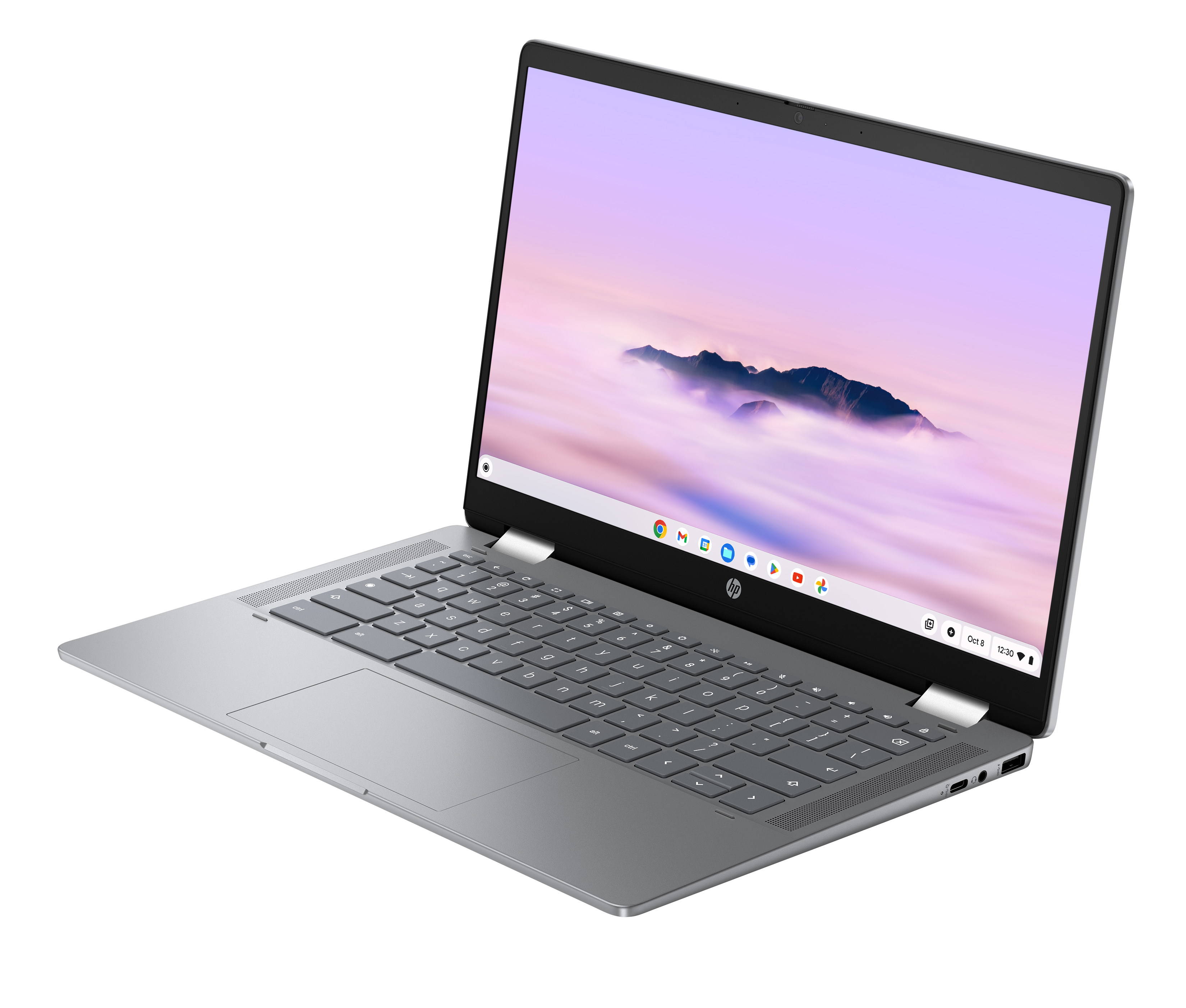 Een zilveren laptop met toetsenbord en scherm die een berglandschap toont.