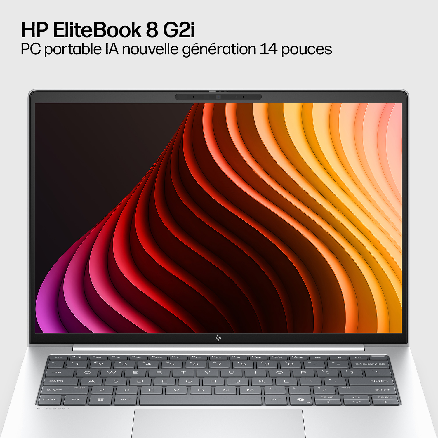 Ordinateur portable HP EliteBook argenté avec fond d'écran abstrait sur écran et clavier.