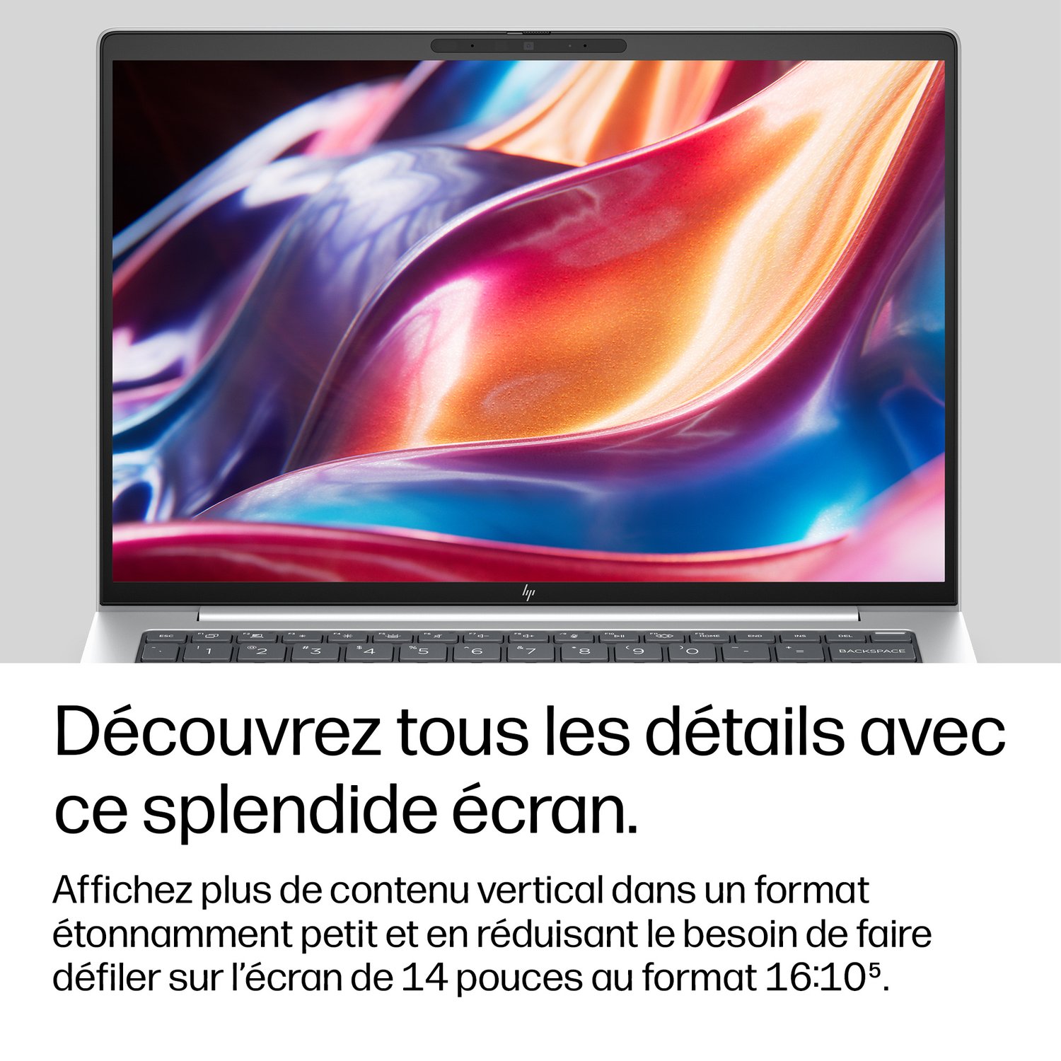 Un ordinateur portable affichant un arrière-plan abstrait coloré.