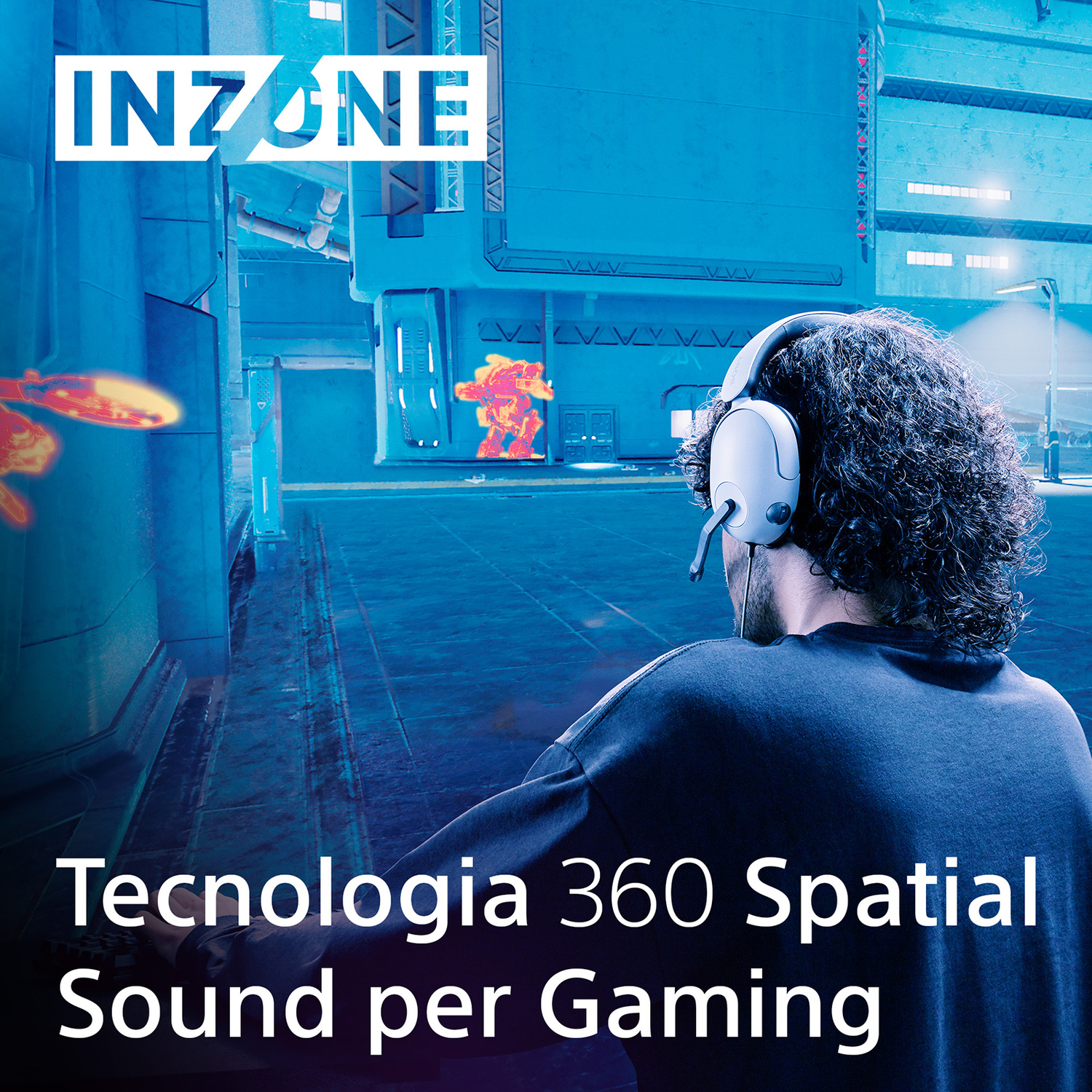 Persona con cuffie, di spalle, gioca a un gioco futuristico con elementi luminosi.