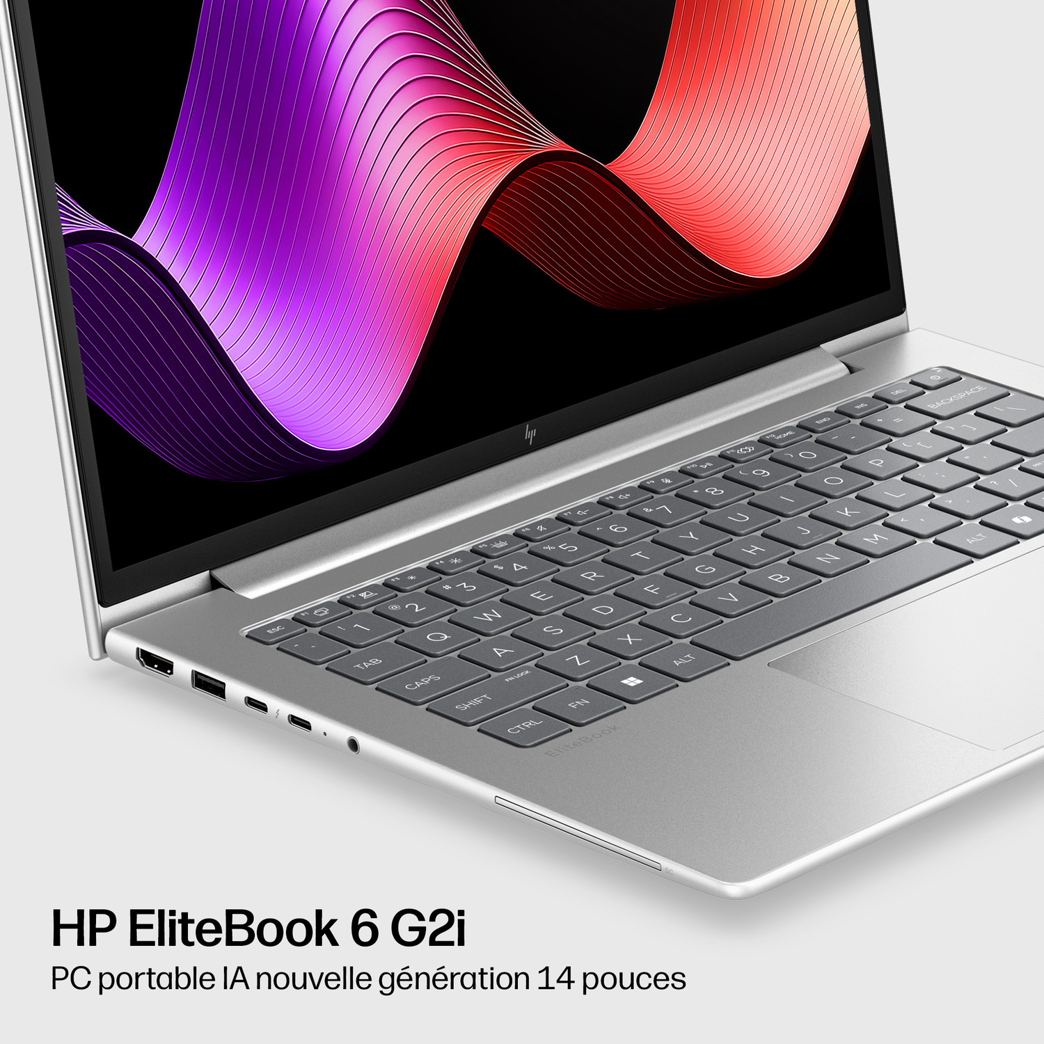 Ordinateur portable HP EliteBook 6 G2i argenté avec fond d'écran abstrait violet et rouge.