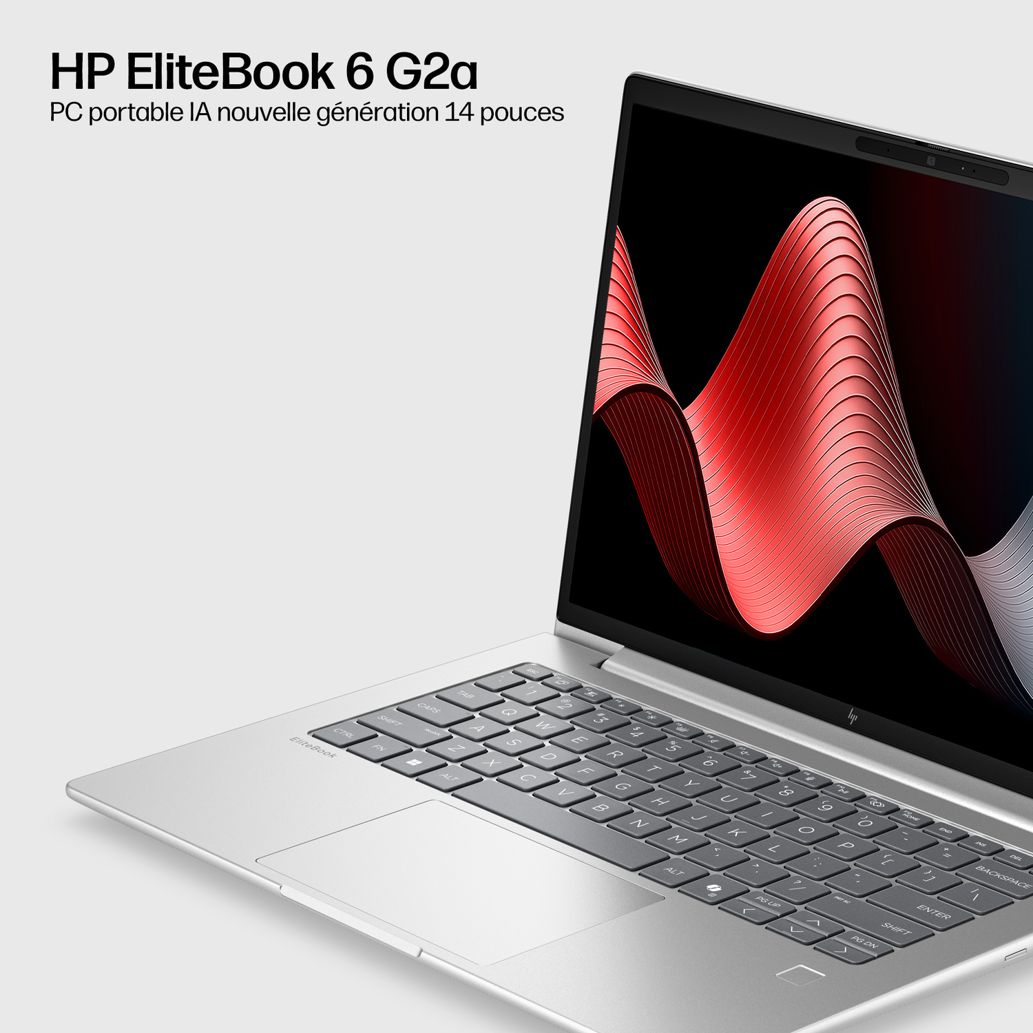 Ordinateur portable HP EliteBook argenté avec clavier et motif ondulé rouge.
