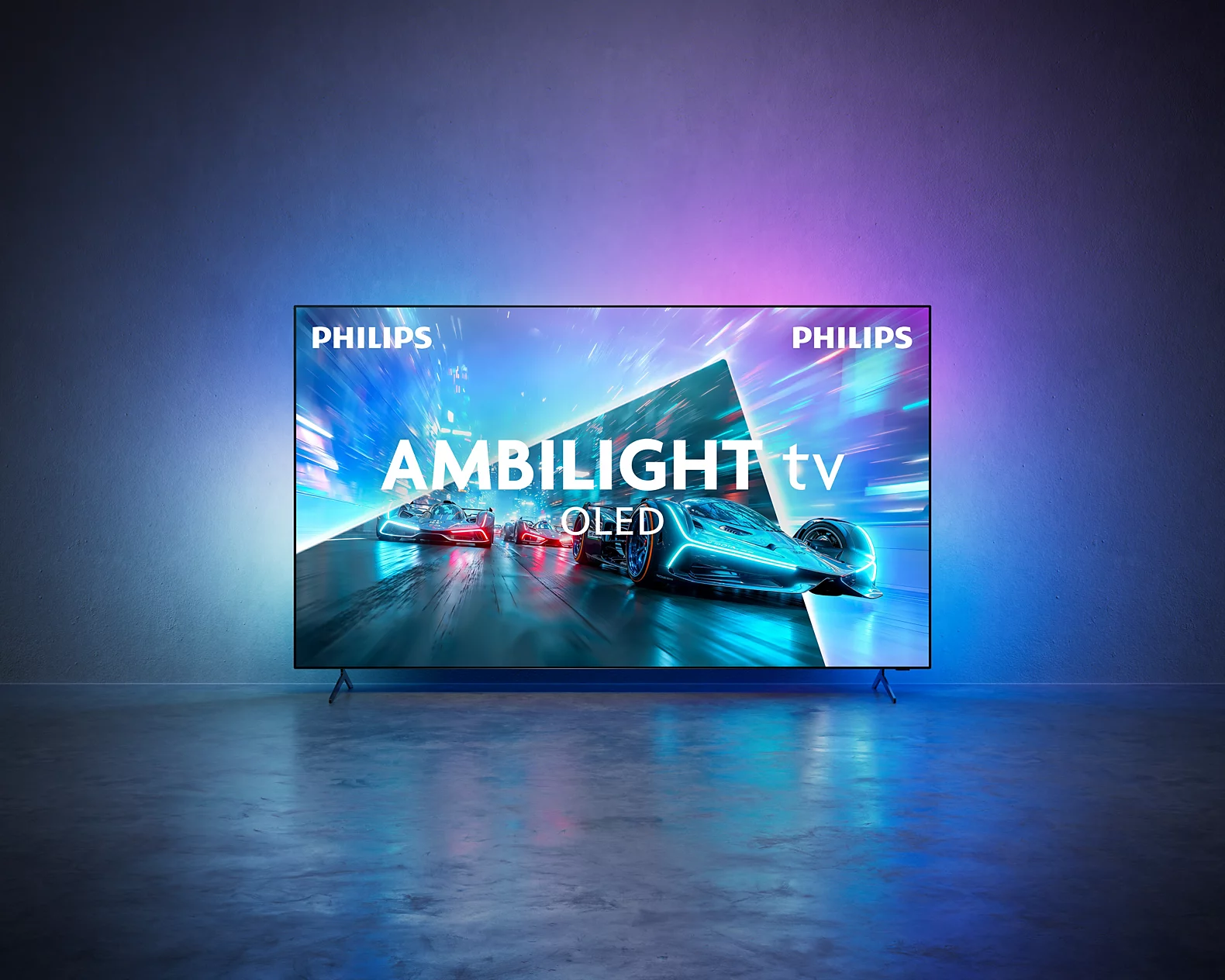 Un televisor Philips Ambilight OLED muestra una carrera con coches futuristas.