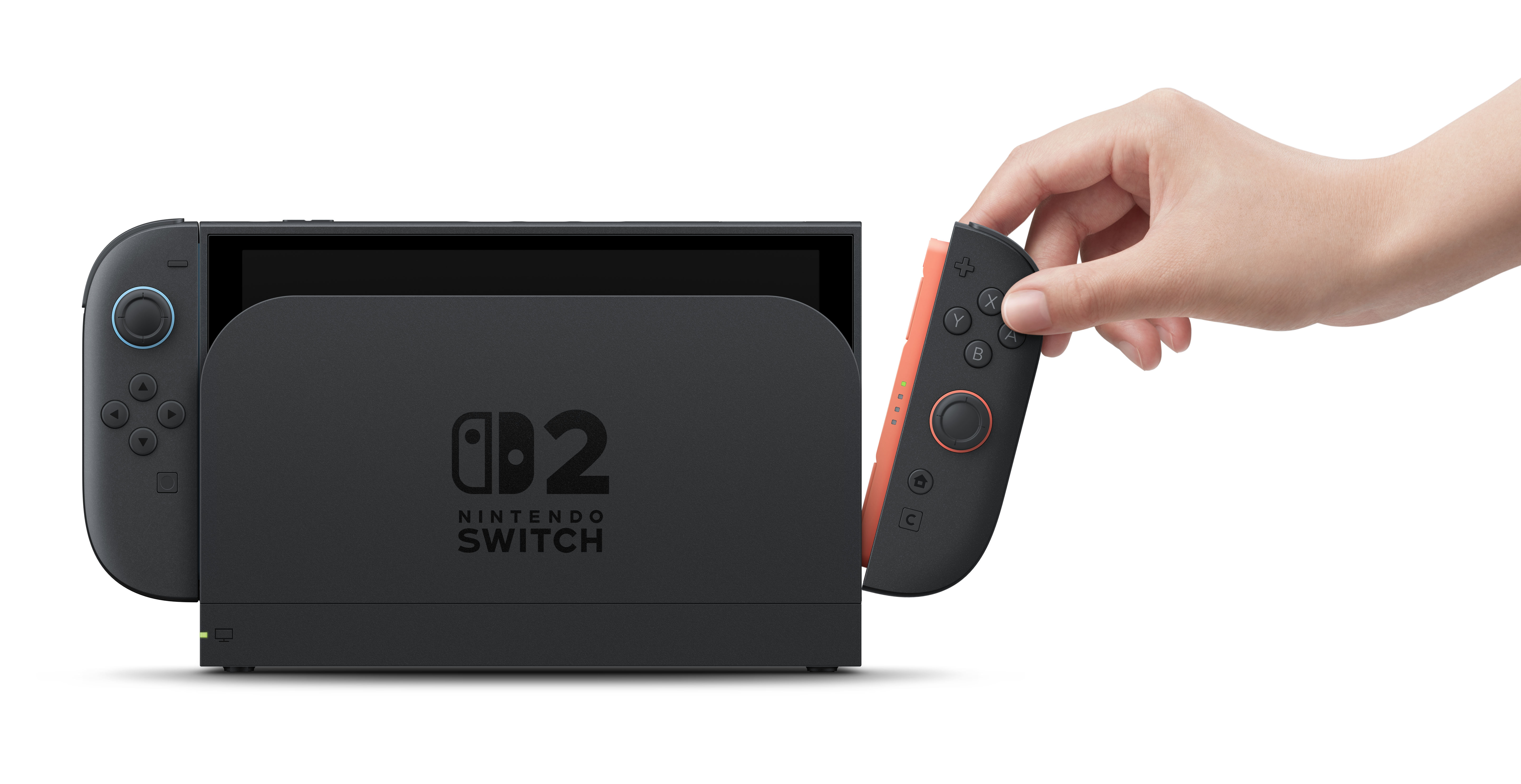 Bir el, siyah bir Nintendo Switch konsolunun yanına yerleştirilen turuncu bir Joy-Con tutuyor.
