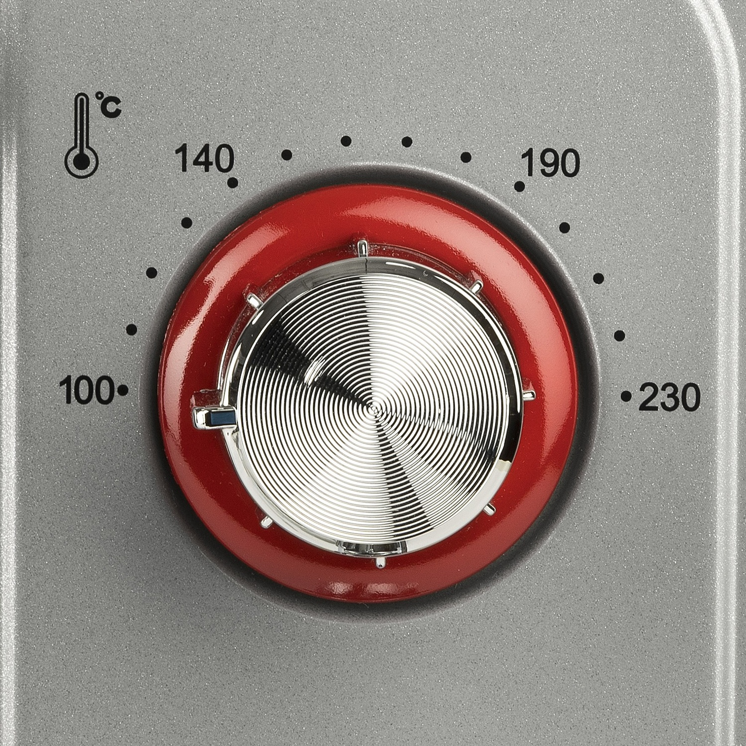 Una manopola rossa con impostazioni di temperatura da 100 a 230 gradi Celsius.
