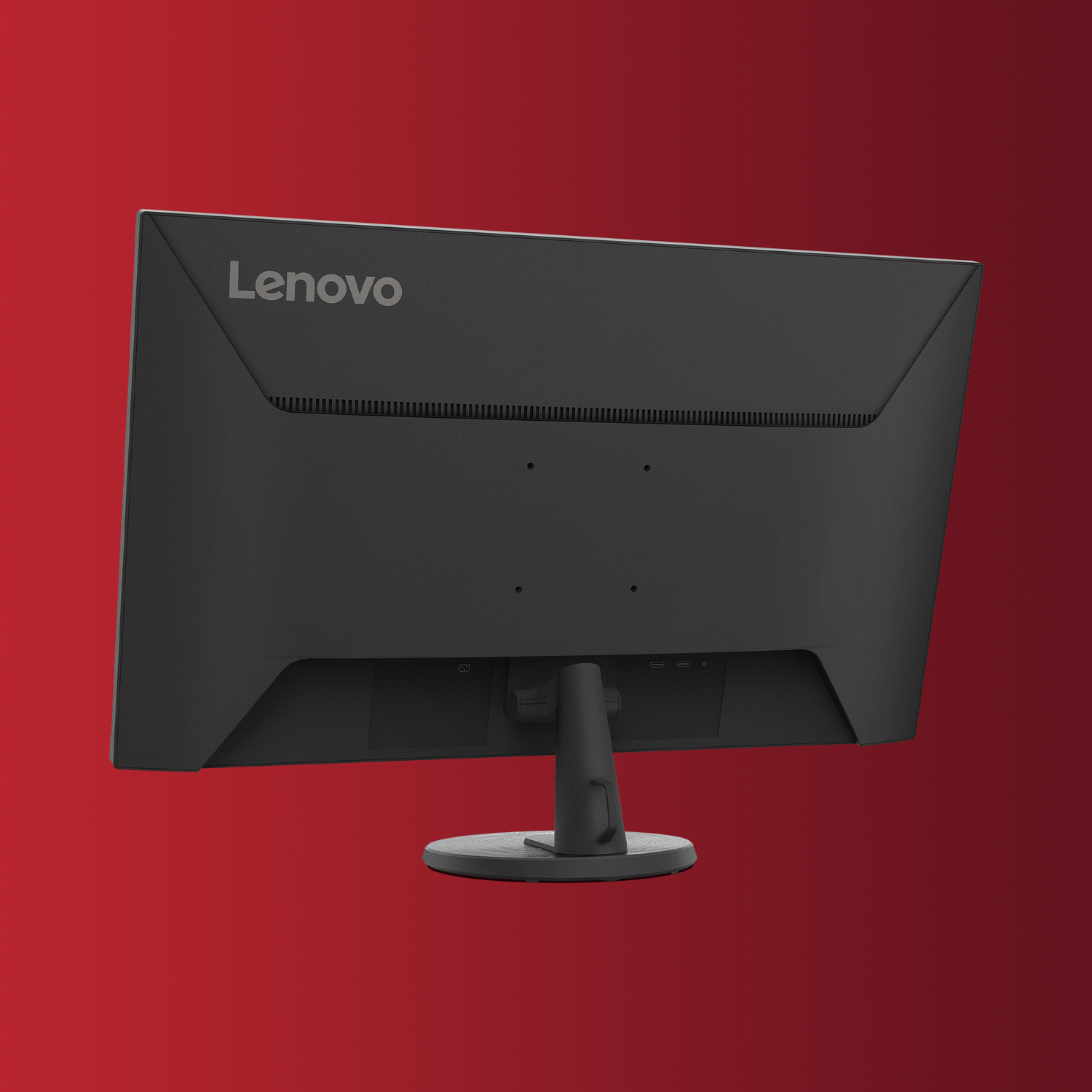 Retro di un monitor Lenovo nero con logo argentato su sfondo rosso.