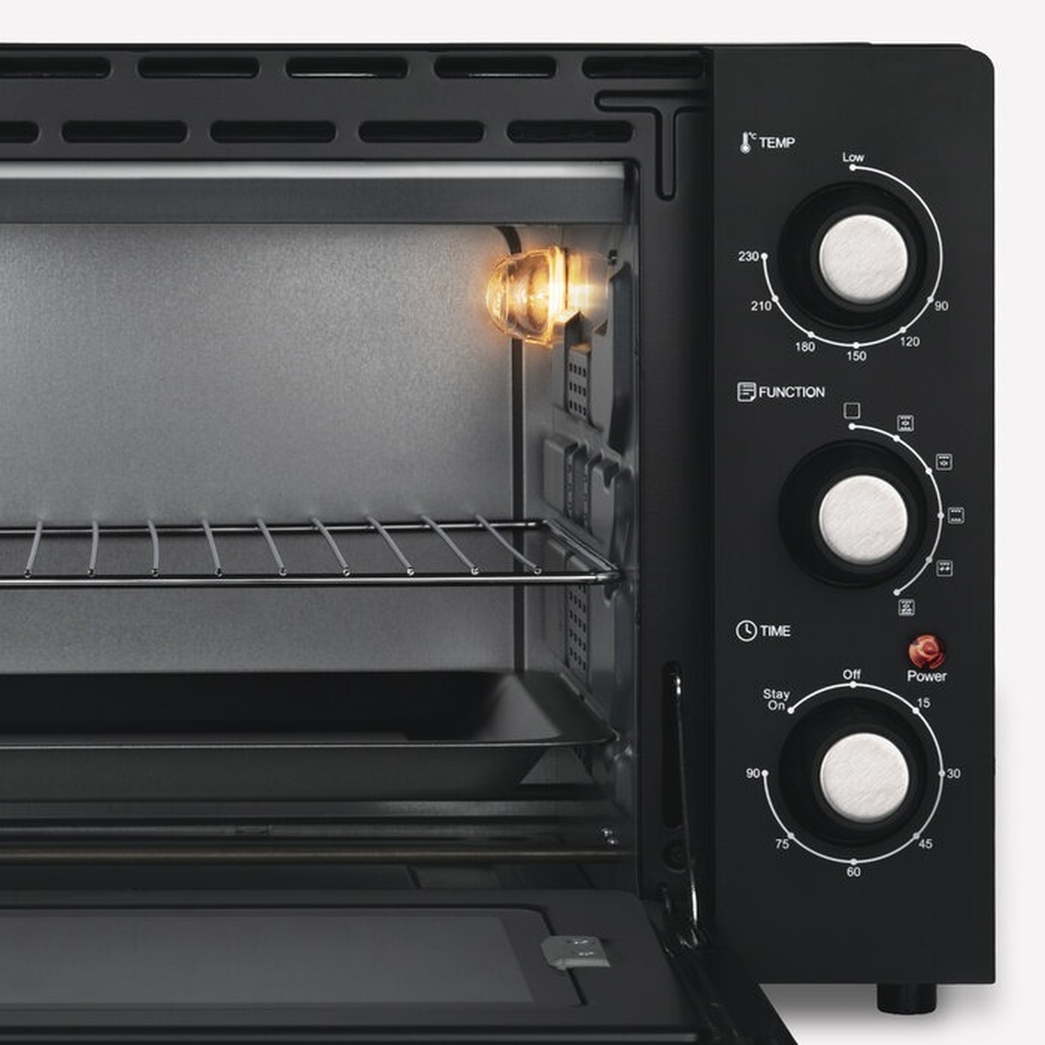Un forno tostapane nero con tre manopole per impostazioni di temperatura, funzione e tempo.