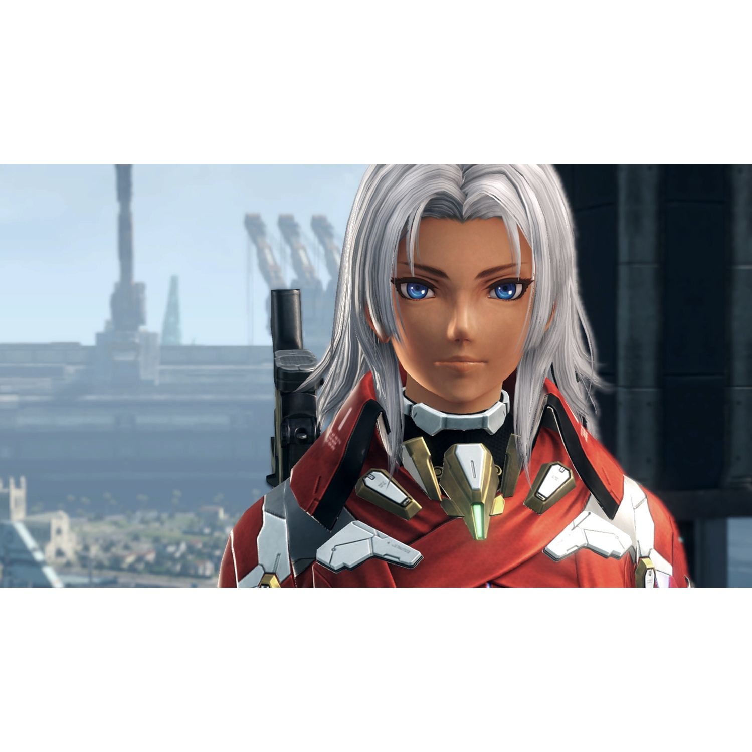 A man with long white hair and blue eyes wearing a red suit.