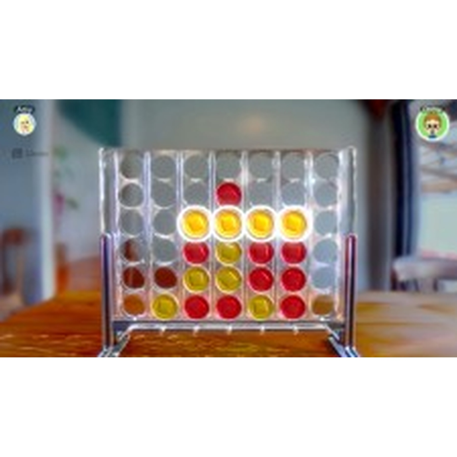 A Connect 4 game with red and yellow discs on a wooden table.